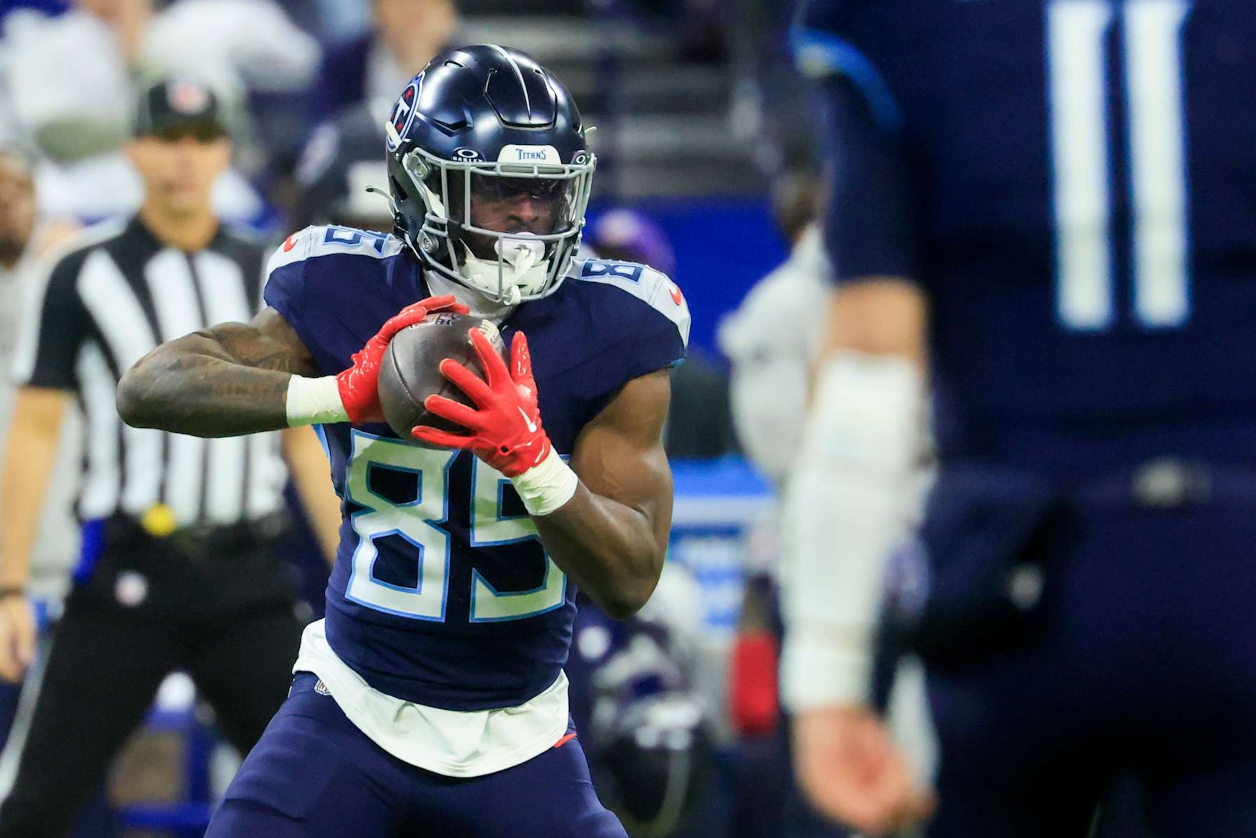 INDIANAPOLIS, INDIANA - DECEMBER 22: Chig Okonkwo #85 of the Tennessee Titans looks to pass against the Indianapolis Colts during the first quarter at Lucas Oil Stadium on December 22, 2024 in Indianapolis, Indiana. (Photo by Justin Casterline/Getty Images)