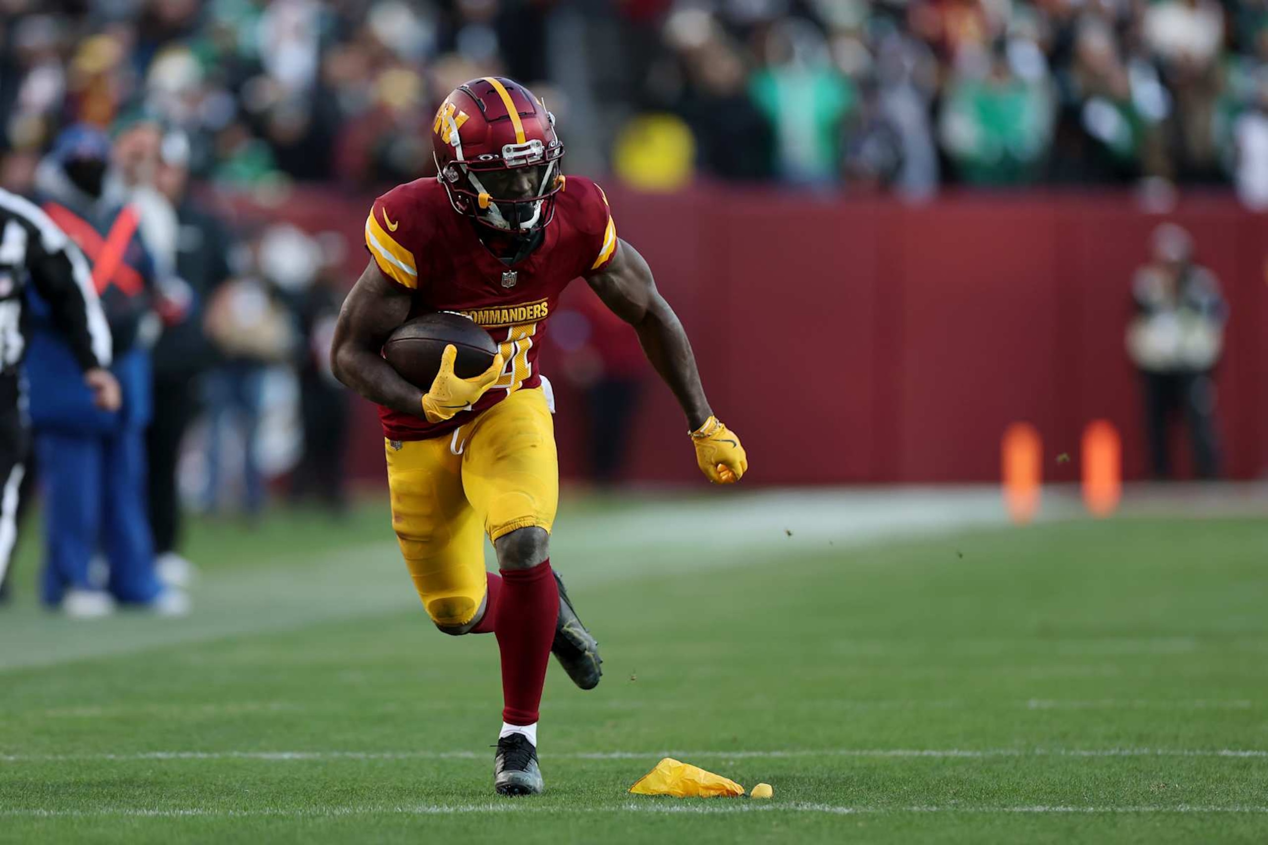LANDOVER, MARYLAND - DECEMBER 22: Olamide Zaccheaus #14 of the Washington Commanders scores a touchdown reception against the Philadelphia Eagles during the fourth quarter at Northwest Stadium on December 22, 2024 in Landover, Maryland. (Photo by Scott Taetsch/Getty Images) LANDOVER, MARYLAND - DECEMBER 22: Olamide Zaccheaus #14 of the Washington Commanders scores a touchdown reception against the Philadelphia Eagles during the fourth quarter at Northwest Stadium on December 22, 2024 in Landover, Maryland. (Photo by Scott Taetsch/Getty Images)