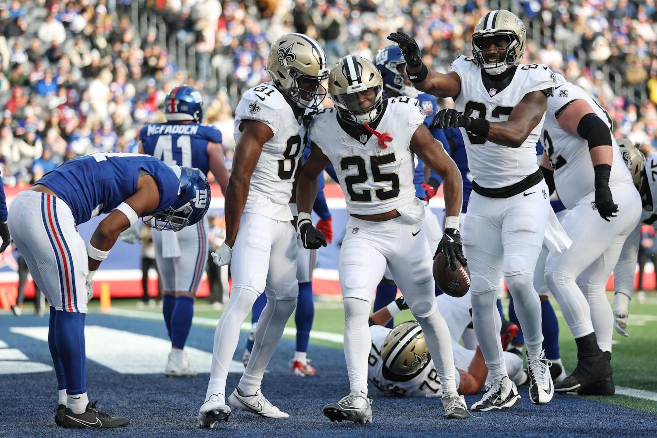 EAST RUTHERFORD, NEW JERSEY - DECEMBER 08: Kendre Miller #25 of the New Orleans Saints celebrates a touchdown with teammates during the first quarter against the New York Giants at MetLife Stadium on December 08, 2024 in East Rutherford, New Jersey. (Photo by Sarah Stier/Getty Images) EAST RUTHERFORD, NEW JERSEY - DECEMBER 08: Kendre Miller #25 of the New Orleans Saints celebrates a touchdown with teammates during the first quarter against the New York Giants at MetLife Stadium on December 08, 2024 in East Rutherford, New Jersey. (Photo by Sarah Stier/Getty Images)