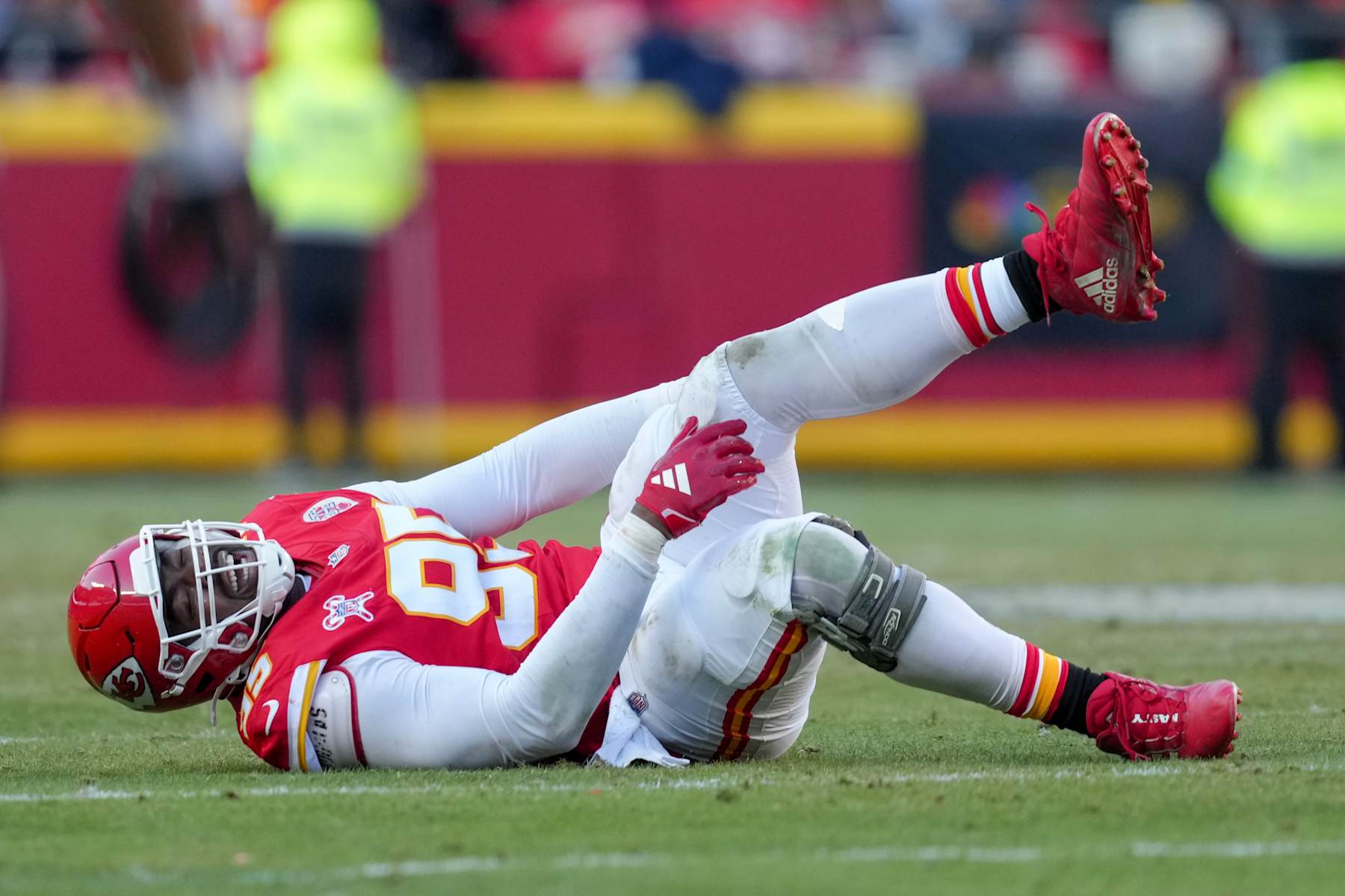 KANSAS CITY, MISSOURI - DECEMBER 21: Chris Jones #95 of the Kansas City Chiefs reacts after sustaining an injury in the fourth quarter of a game against the Houston Texans at GEHA Field at Arrowhead Stadium on December 21, 2024 in Kansas City, Missouri. (Photo by Jason Hanna/Getty Images)