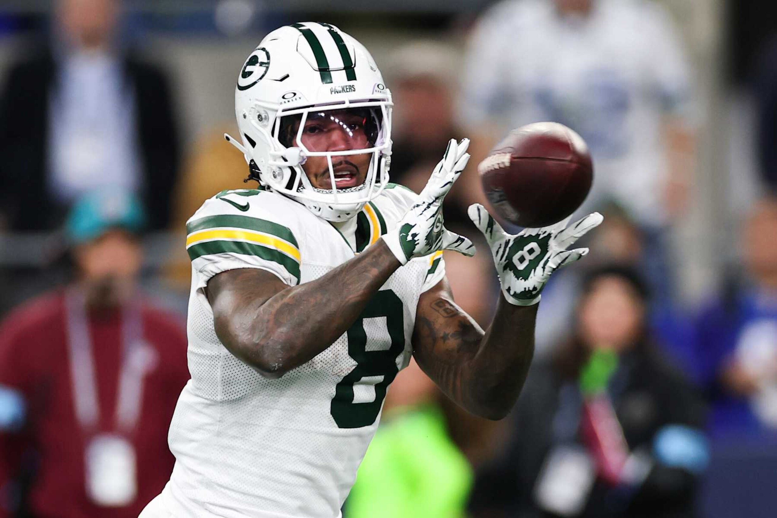 SEATTLE, WASHINGTON - DECEMBER 15: Josh Jacobs #8 of the Green Bay Packers catches a pass against the Seattle Seahawks during the first quarter of the game at Lumen Field on December 15, 2024 in Seattle, Washington. (Photo by Steph Chambers/Getty Images)