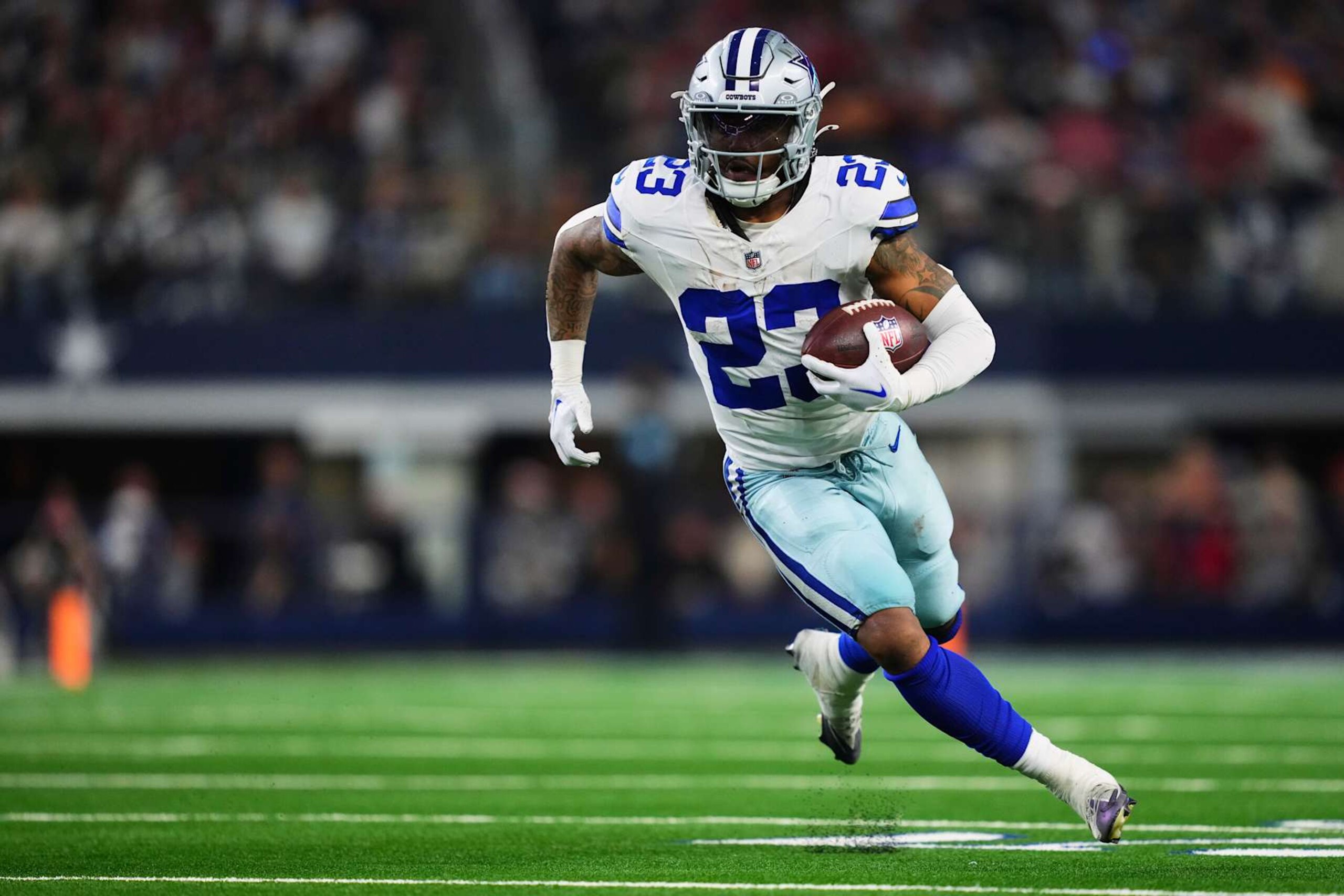 ARLINGTON, TX - DECEMBER 22: Rico Dowdle #23 of the Dallas Cowboys carries the ball against the Tampa Bay Buccaneers during an NFL football game at AT&T Stadium on December 22, 2024 in Arlington, Texas. (Photo by Cooper Neill/Getty Images)