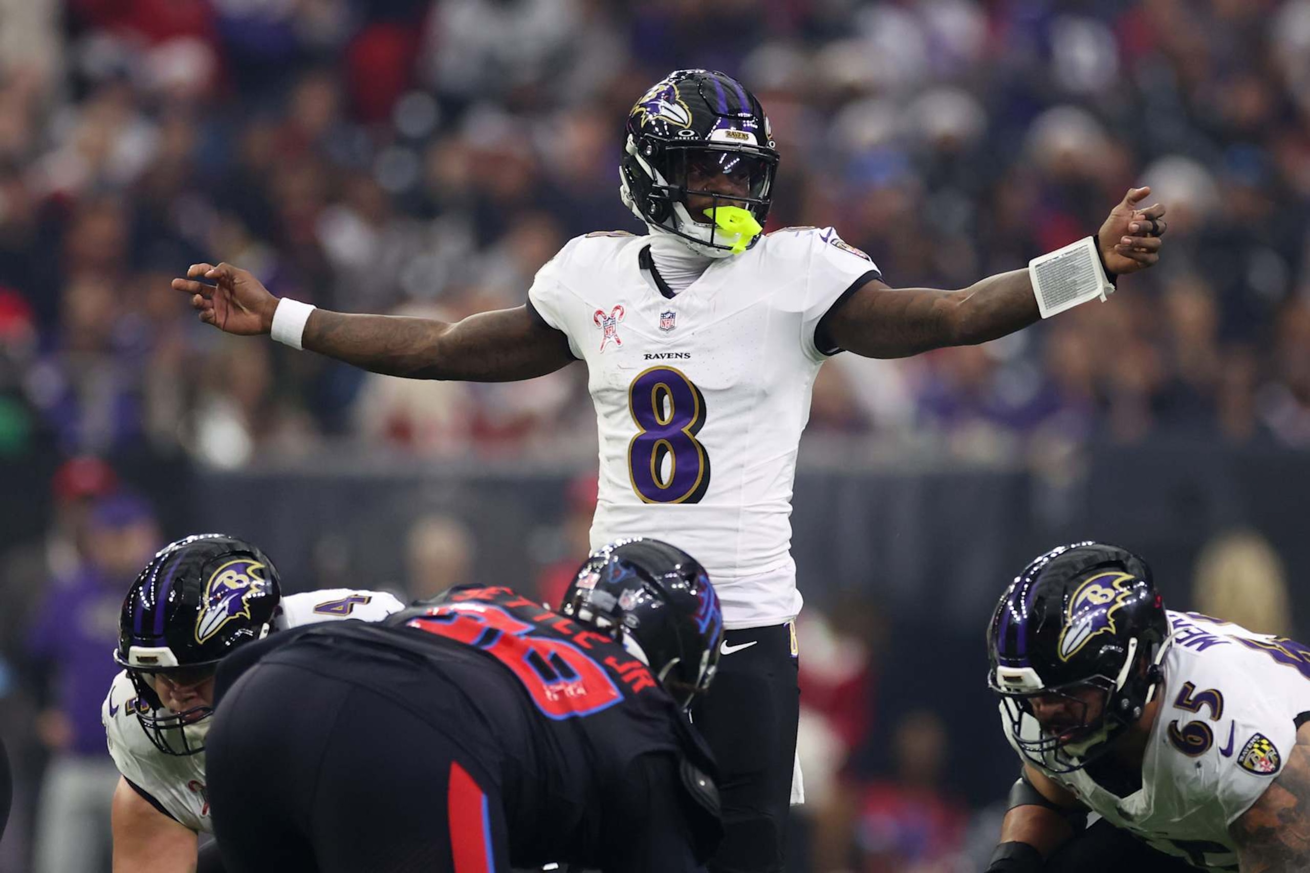 HOUSTON, TEXAS - DECEMBER 25: Lamar Jackson #8 of the Baltimore Ravens directs his team during the first quarter against the Houston Texans at NRG Stadium on December 25, 2024 in Houston, Texas. (Photo by Tim Warner/Getty Images) HOUSTON, TEXAS - DECEMBER 25: Lamar Jackson #8 of the Baltimore Ravens directs his team during the first quarter against the Houston Texans at NRG Stadium on December 25, 2024 in Houston, Texas. (Photo by Tim Warner/Getty Images)