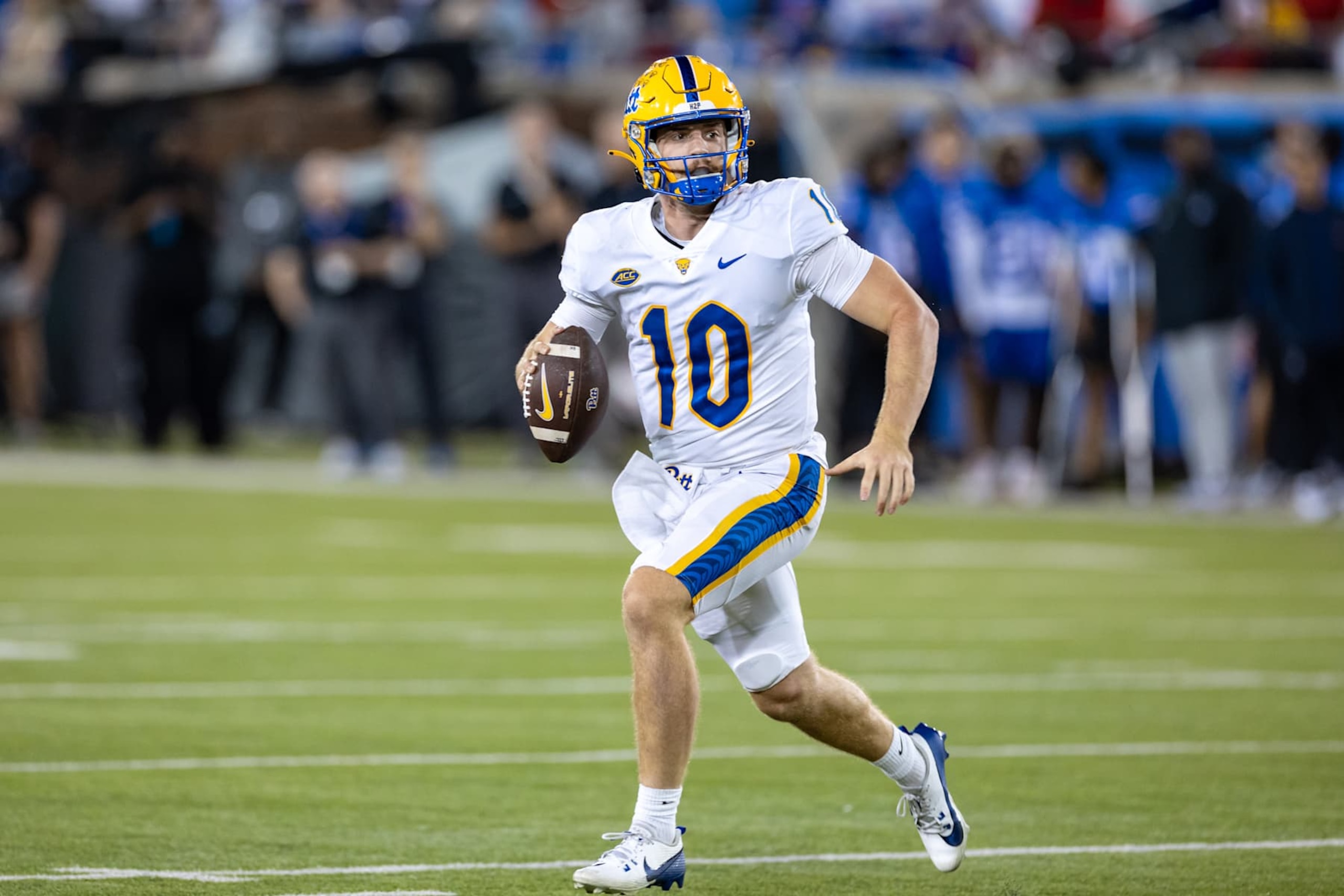 DALLAS, TX - NOVEMBER 02: Pittsburgh Panthers quarterback Eli Holstein (#10) rolls out of the pocket during the college football game between the SMU Mustangs and the Pittsburgh Panthers on November 2, 2024, at Gerald J. Ford Stadium in Dallas, TX.  (Photo by Matthew Visinsky/Icon Sportswire via Getty Images)