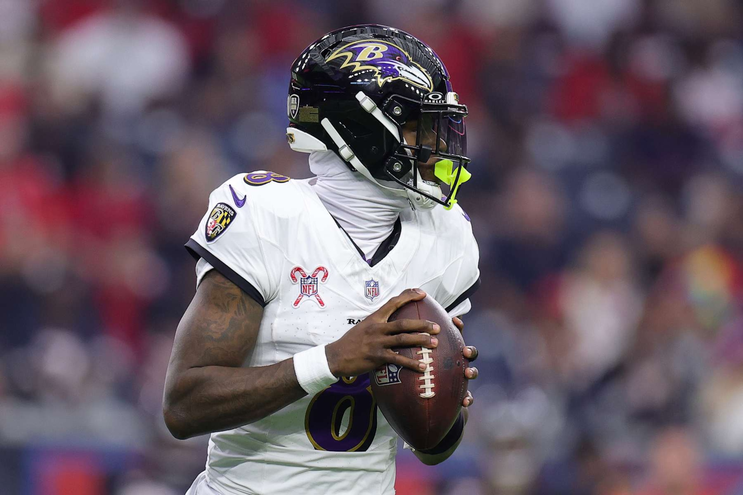 HOUSTON, TEXAS - DECEMBER 25: Lamar Jackson #8 of the Baltimore Ravens steps back to pass during the first quarter against the Houston Texans at NRG Stadium on December 25, 2024 in Houston, Texas. (Photo by Alex Slitz/Getty Images)