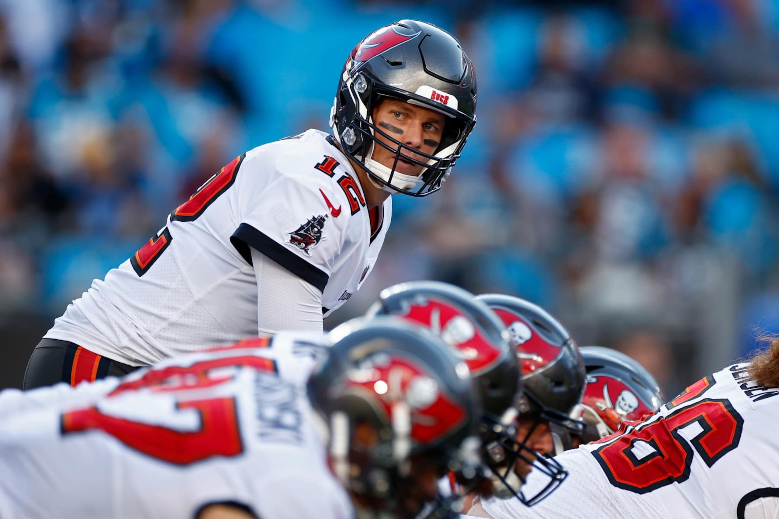 CHARLOTTE, NORTH CAROLINA - DECEMBER 26: Tom Brady #12 of the Tampa Bay Buccaneers prepares to snap the ball during the fourth quarter in the game against the Carolina Panthers at Bank of America Stadium on December 26, 2021 in Charlotte, North Carolina. (Photo by Jared C. Tilton/Getty Images)