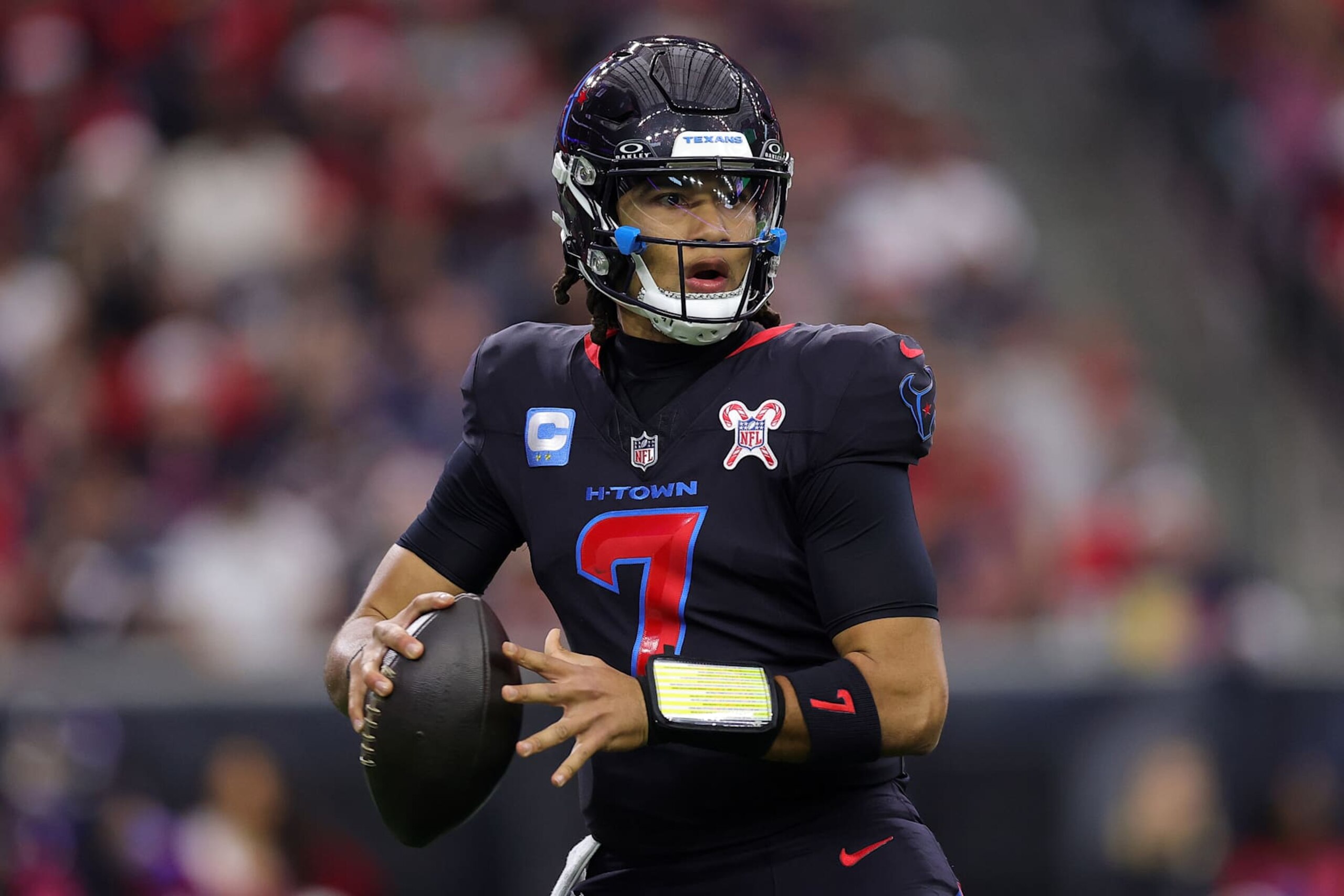 HOUSTON, TEXAS - DECEMBER 25: C.J. Stroud #7 of the Houston Texans looks to pass during the second quarter against the Baltimore Ravens at NRG Stadium on December 25, 2024 in Houston, Texas. (Photo by Alex Slitz/Getty Images)