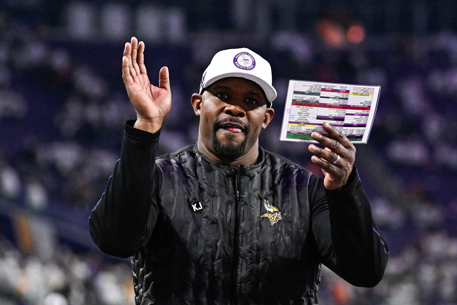 MINNEAPOLIS, MINNESOTA - DECEMBER 16: Brian Flores defensive coordinator of the Minnesota Vikings celebrates after the game against the Chicago Bears at U.S. Bank Stadium on December 16, 2024 in Minneapolis, Minnesota. The Vikings defeated the Bears 30-12. (Photo by Stephen Maturen/Getty Images)