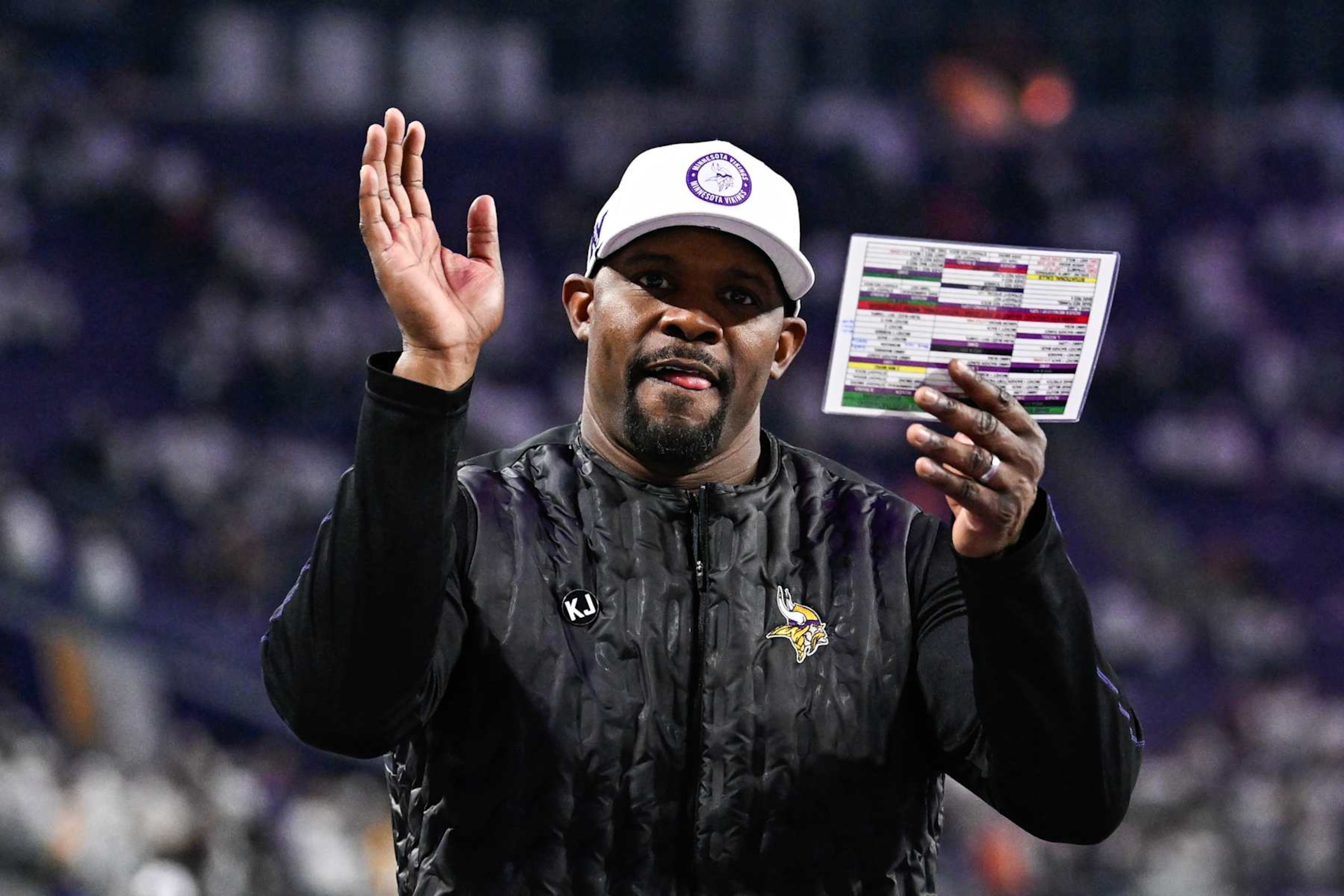 MINNEAPOLIS, MINNESOTA - DECEMBER 16: Brian Flores defensive coordinator of the Minnesota Vikings celebrates after the game against the Chicago Bears at U.S. Bank Stadium on December 16, 2024 in Minneapolis, Minnesota. The Vikings defeated the Bears 30-12. (Photo by Stephen Maturen/Getty Images)