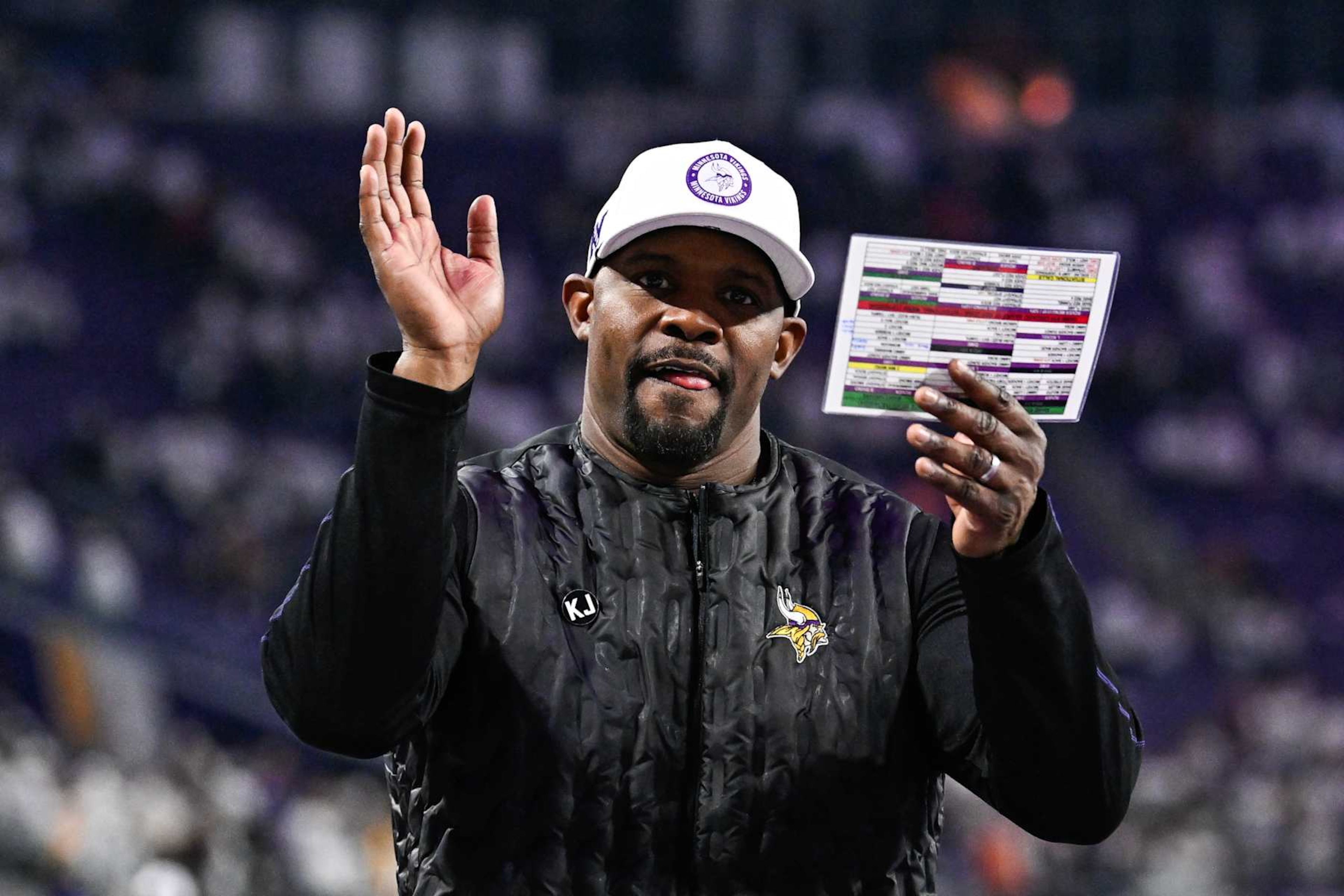 MINNEAPOLIS, MINNESOTA - DECEMBER 16: Brian Flores defensive coordinator of the Minnesota Vikings celebrates after the game against the Chicago Bears at U.S. Bank Stadium on December 16, 2024 in Minneapolis, Minnesota. The Vikings defeated the Bears 30-12. (Photo by Stephen Maturen/Getty Images) MINNEAPOLIS, MINNESOTA - DECEMBER 16: Brian Flores defensive coordinator of the Minnesota Vikings celebrates after the game against the Chicago Bears at U.S. Bank Stadium on December 16, 2024 in Minneapolis, Minnesota. The Vikings defeated the Bears 30-12. (Photo by Stephen Maturen/Getty Images)