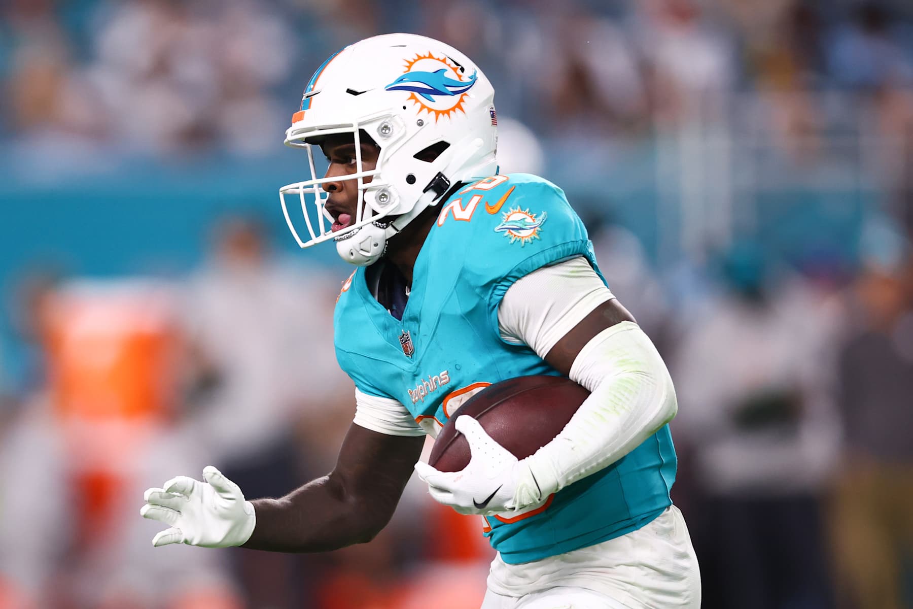 MIAMI GARDENS, FLORIDA - DECEMBER 22: De'Von Achane #28 of the Miami Dolphins carries the ball against the San Francisco 49ers during the second half of the game at Hard Rock Stadium on December 22, 2024 in Miami Gardens, Florida. (Photo by Megan Briggs/Getty Images)
