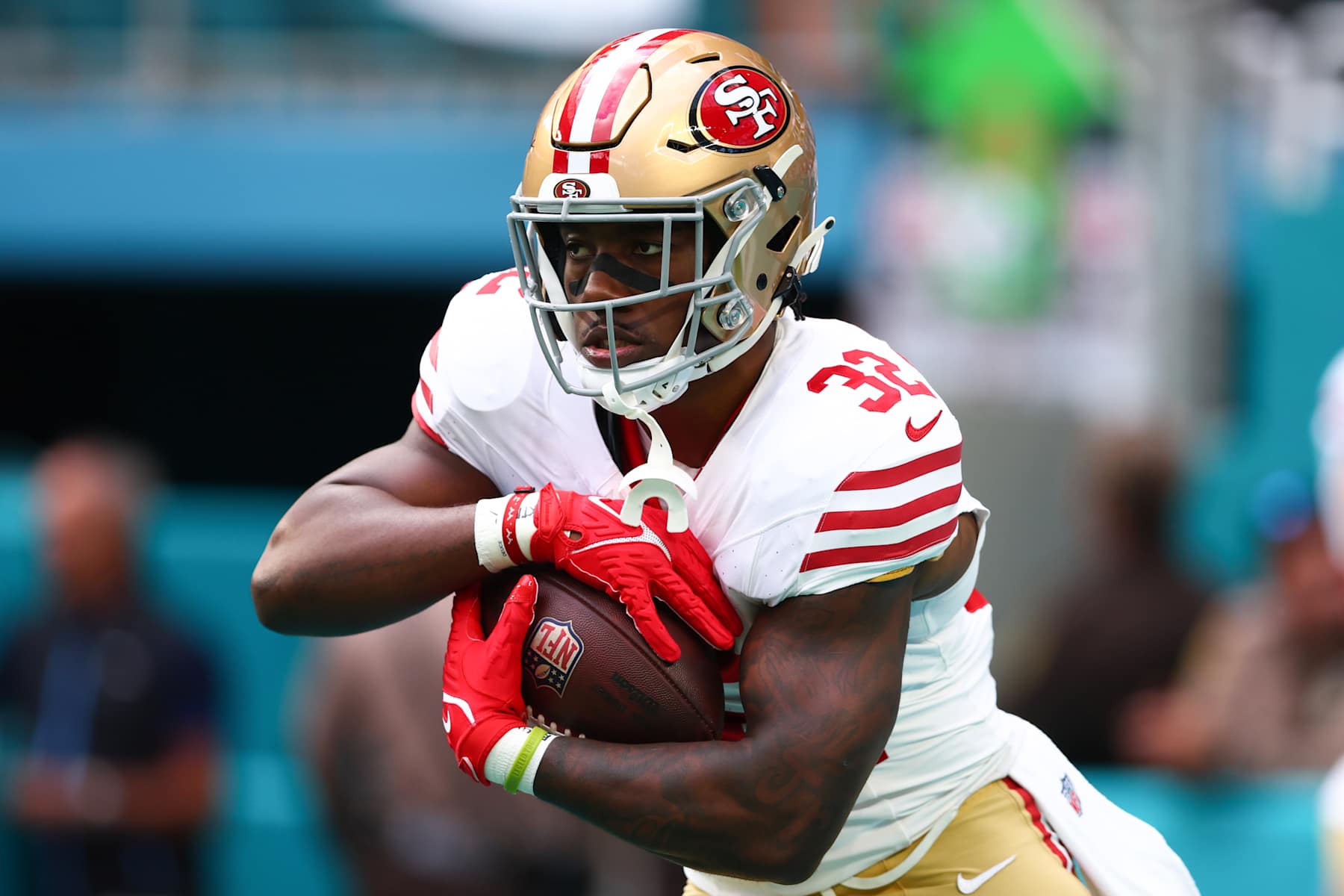 MIAMI GARDENS, FLORIDA - DECEMBER 22: Patrick Taylor Jr. #32 of the San Francisco 49ers warms up prior to playing the Miami Dolphins at Hard Rock Stadium on December 22, 2024 in Miami Gardens, Florida. (Photo by Megan Briggs/Getty Images)