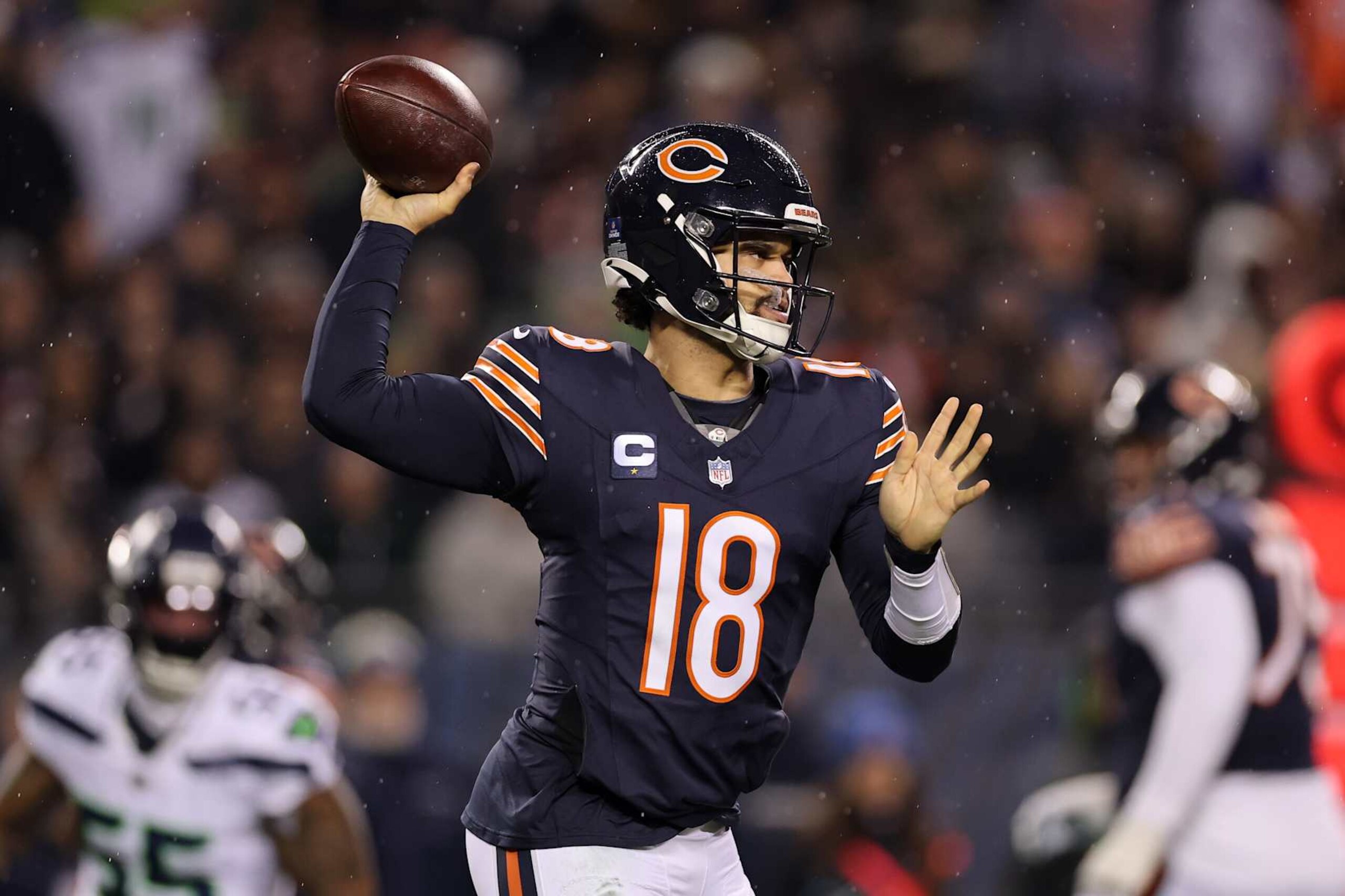 CHICAGO, ILLINOIS - DECEMBER 26: Caleb Williams #18 of the Chicago Bears throws a pass against the Seattle Seahawks /d1 at Soldier Field on December 26, 2024 in Chicago, Illinois. (Photo by Michael Reaves/Getty Images)