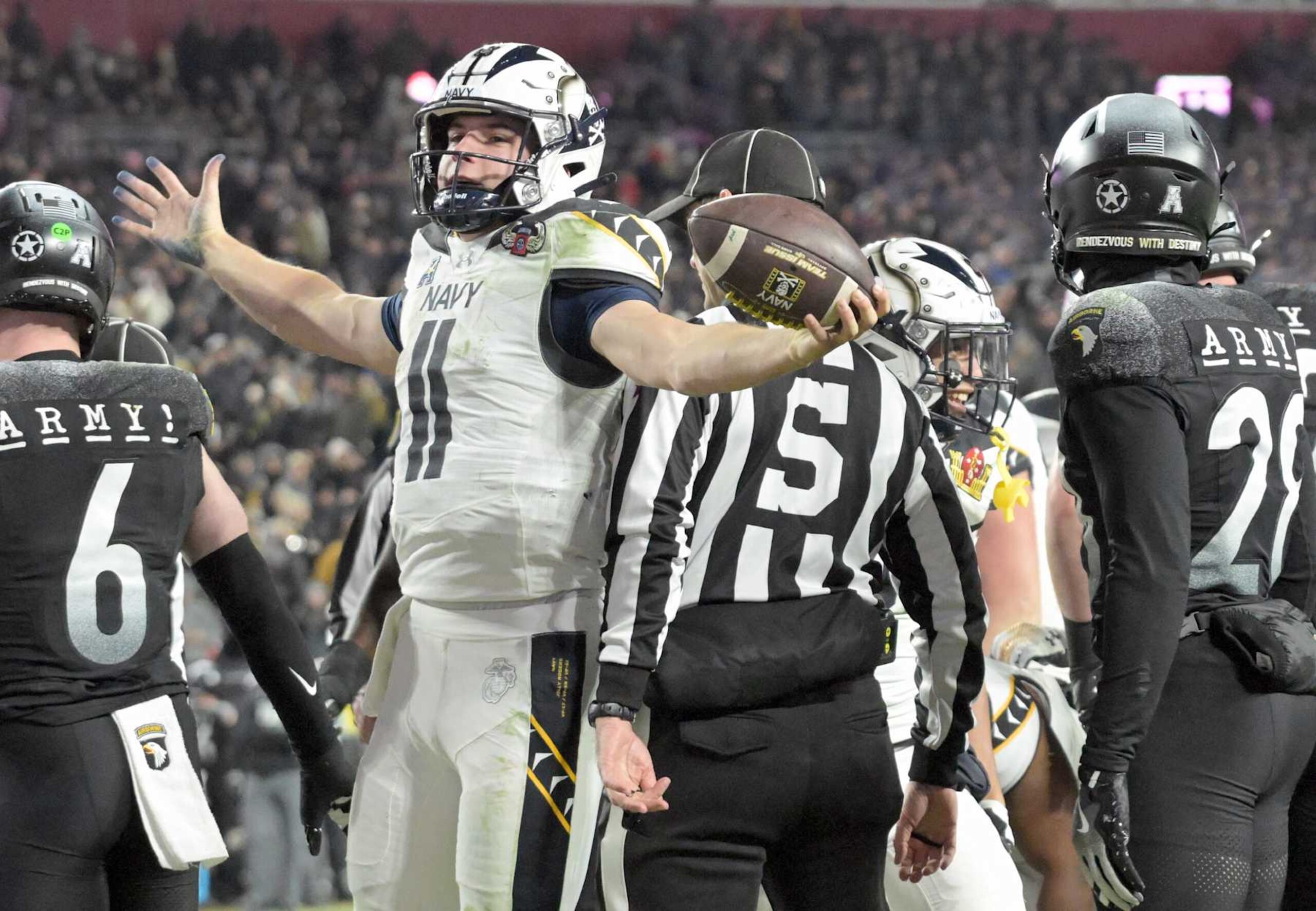LANDOVER, MD - DECEMBER 14:   Navy Midshipmen quarterback Blake Horvath (11) celebrates his touchdown run during the 125th Army Black Knights game versus the Naval Academy Midshipmen on December 14, 2024 at Northwest Stadium in Landover, MD. (Photo by Mark Goldman/Icon Sportswire via Getty Images)