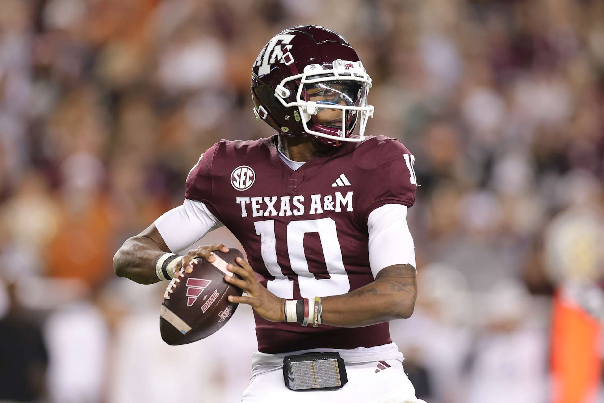 COLLEGE STATION, TEXAS - NOVEMBER 30: Marcel Reed #10 of the Texas A&M Aggies throws the ball during the second quarter against the Texas Longhorns at Kyle Field on November 30, 2024 in College Station, Texas. (Photo by Alex Slitz/Getty Images)