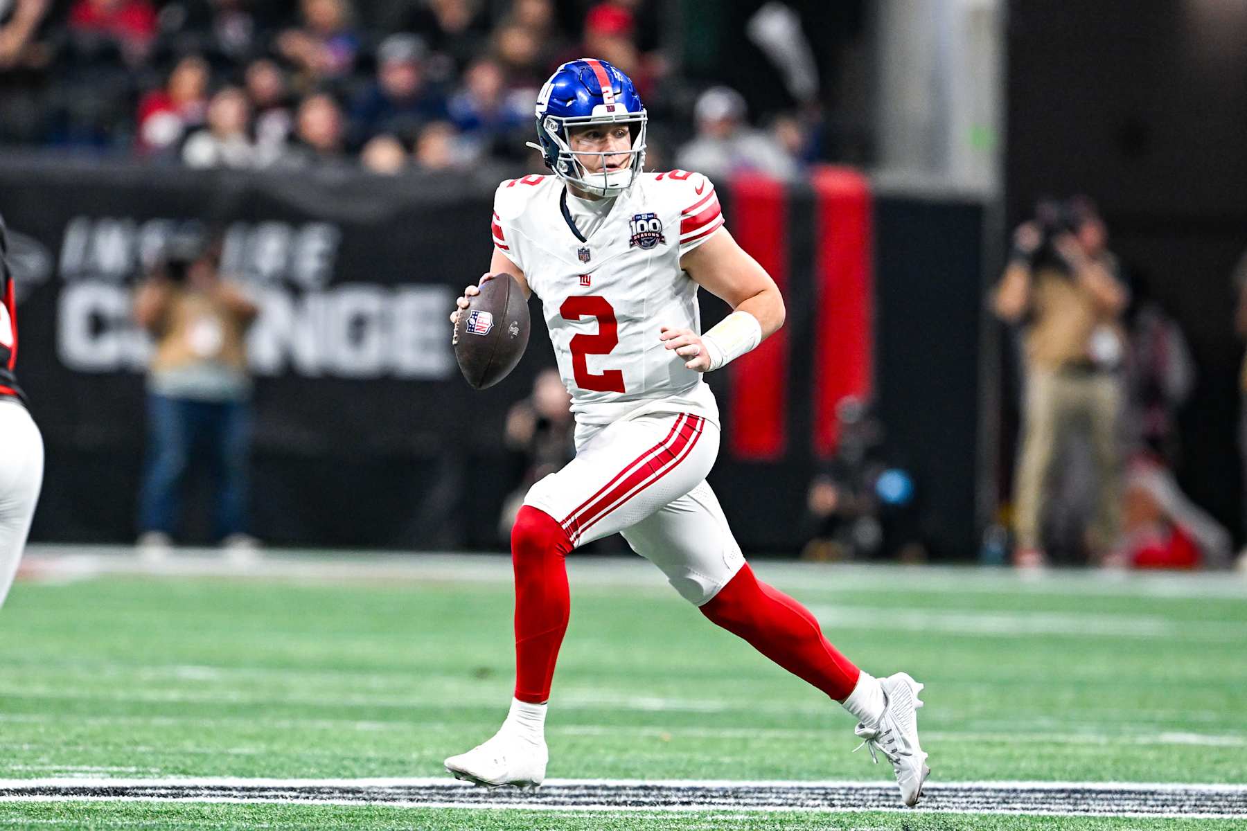 ATLANTA, GA  DECEMBER 22:  New York quarterback Drew Lock (2) rolls out of the pocket during the NFL game between the New York Giants and the Atlanta Falcons on December 22nd, 2024 at Mercedes-Benz Stadium in Atlanta, GA.  (Photo by Rich von Biberstein/Icon Sportswire via Getty Images)