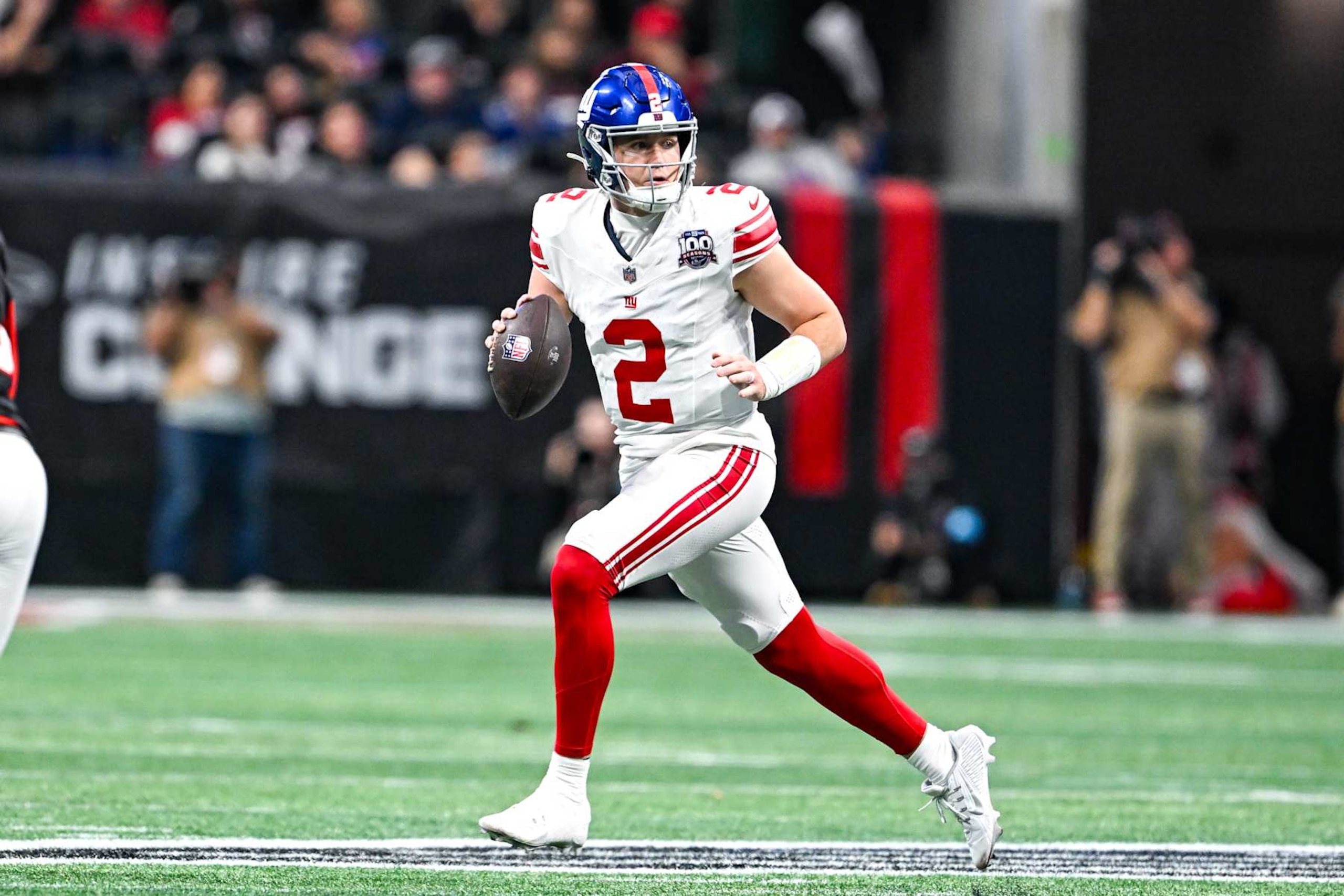 ATLANTA, GA DECEMBER 22: New York quarterback Drew Lock (2) rolls out of the pocket during the NFL game between the New York Giants and the Atlanta Falcons on December 22nd, 2024 at Mercedes-Benz Stadium in Atlanta, GA. (Photo by Rich von Biberstein/Icon Sportswire via Getty Images) ATLANTA, GA DECEMBER 22: New York quarterback Drew Lock (2) rolls out of the pocket during the NFL game between the New York Giants and the Atlanta Falcons on December 22nd, 2024 at Mercedes-Benz Stadium in Atlanta, GA. (Photo by Rich von Biberstein/Icon Sportswire via Getty Images)