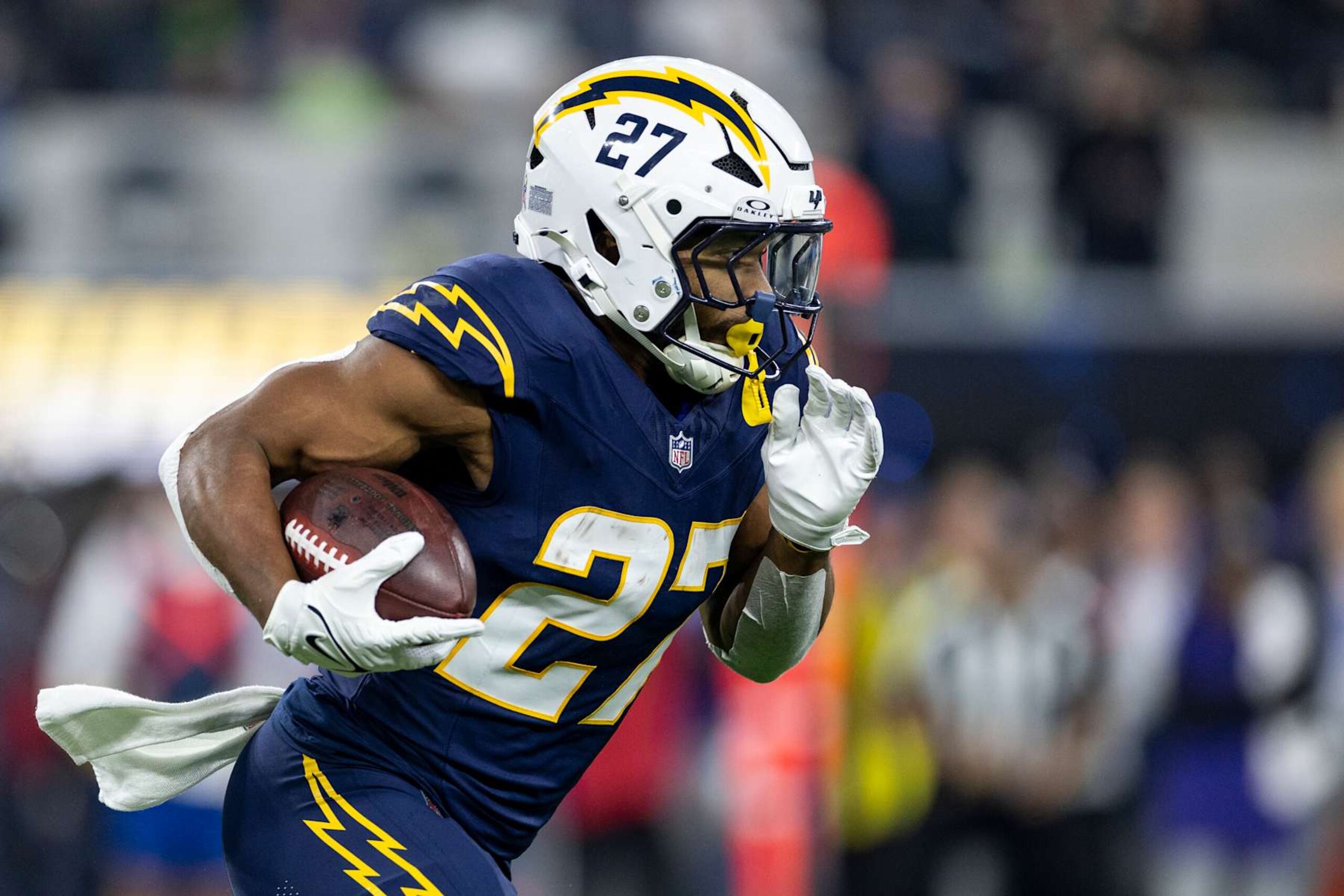 INGLEWOOD, CALIFORINA - NOVEMBER 25: J.K. Dobbins #27 of the Los Angeles Chargers runs with the ball during an NFL Football game against the Baltimore Ravens at SoFi Stadium on November 25, 2024 in Inglewood, Califorina. (Photo by Michael Owens/Getty Images) INGLEWOOD, CALIFORINA - NOVEMBER 25: J.K. Dobbins #27 of the Los Angeles Chargers runs with the ball during an NFL Football game against the Baltimore Ravens at SoFi Stadium on November 25, 2024 in Inglewood, Califorina. (Photo by Michael Owens/Getty Images)