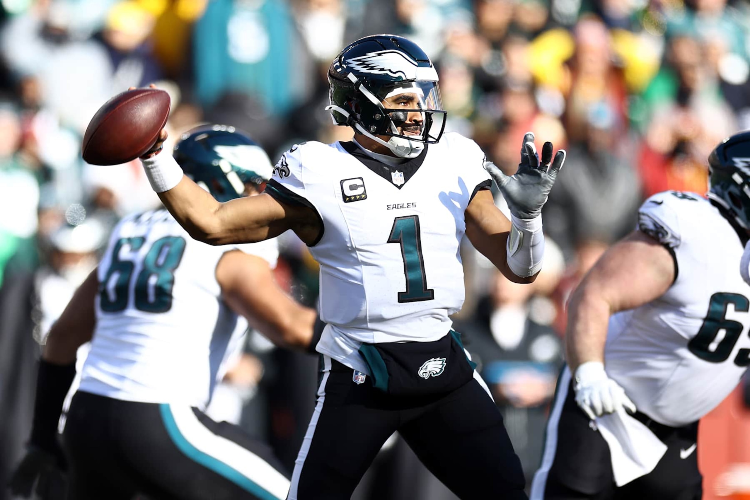 LANDOVER, MARYLAND - DECEMBER 22:  Jalen Hurts #1 of the Philadelphia Eagles attempts a pass against the Washington Commanders during the first quarter at Northwest Stadium on December 22, 2024 in Landover, Maryland. (Photo by Timothy Nwachukwu/Getty Images)