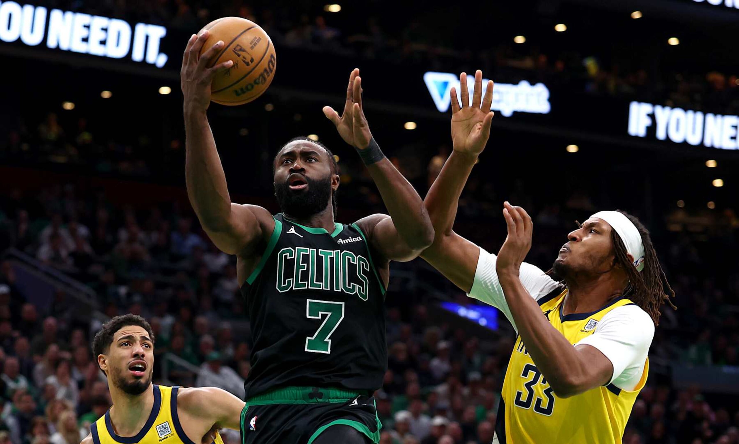 BOSTON, MASSACHUSETTS - DECEMBER 27: Jaylen Brown #7 of the Boston Celtics drives to the basket past Myles Turner #33 of the Indiana Pacers during the first quarter at TD Garden on December 27, 2024 in Boston, Massachusetts. (Photo by Maddie Meyer/Getty Images)