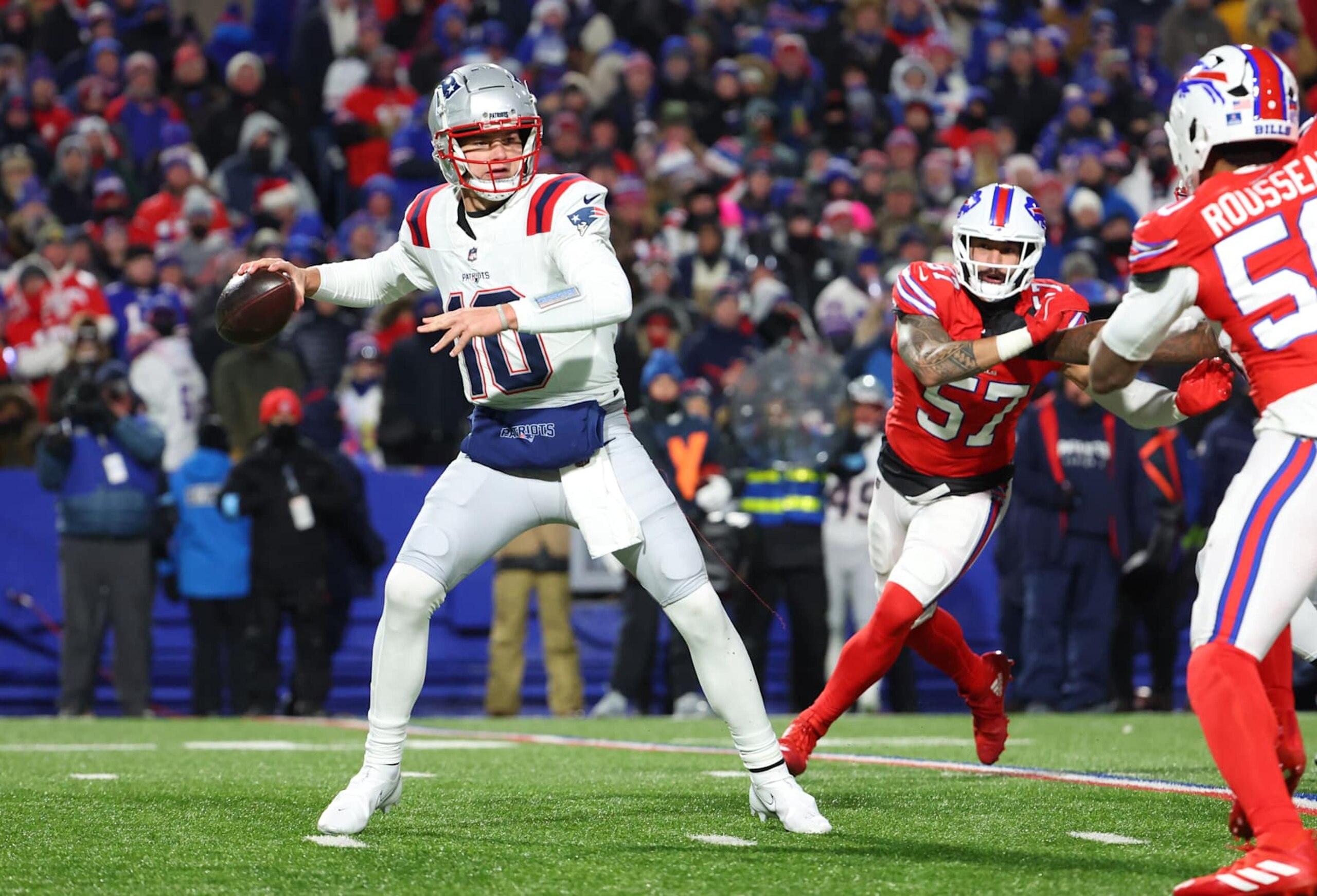 ORCHARD PARK, NEW YORK - DECEMBER 22: Drake Maye #10 of the New England Patriots looks to throw a pass during a game against the Buffalo Bills at Highmark Stadium on December 22, 2024 in Orchard Park, New York. (Photo by Timothy T Ludwig/Getty Images)