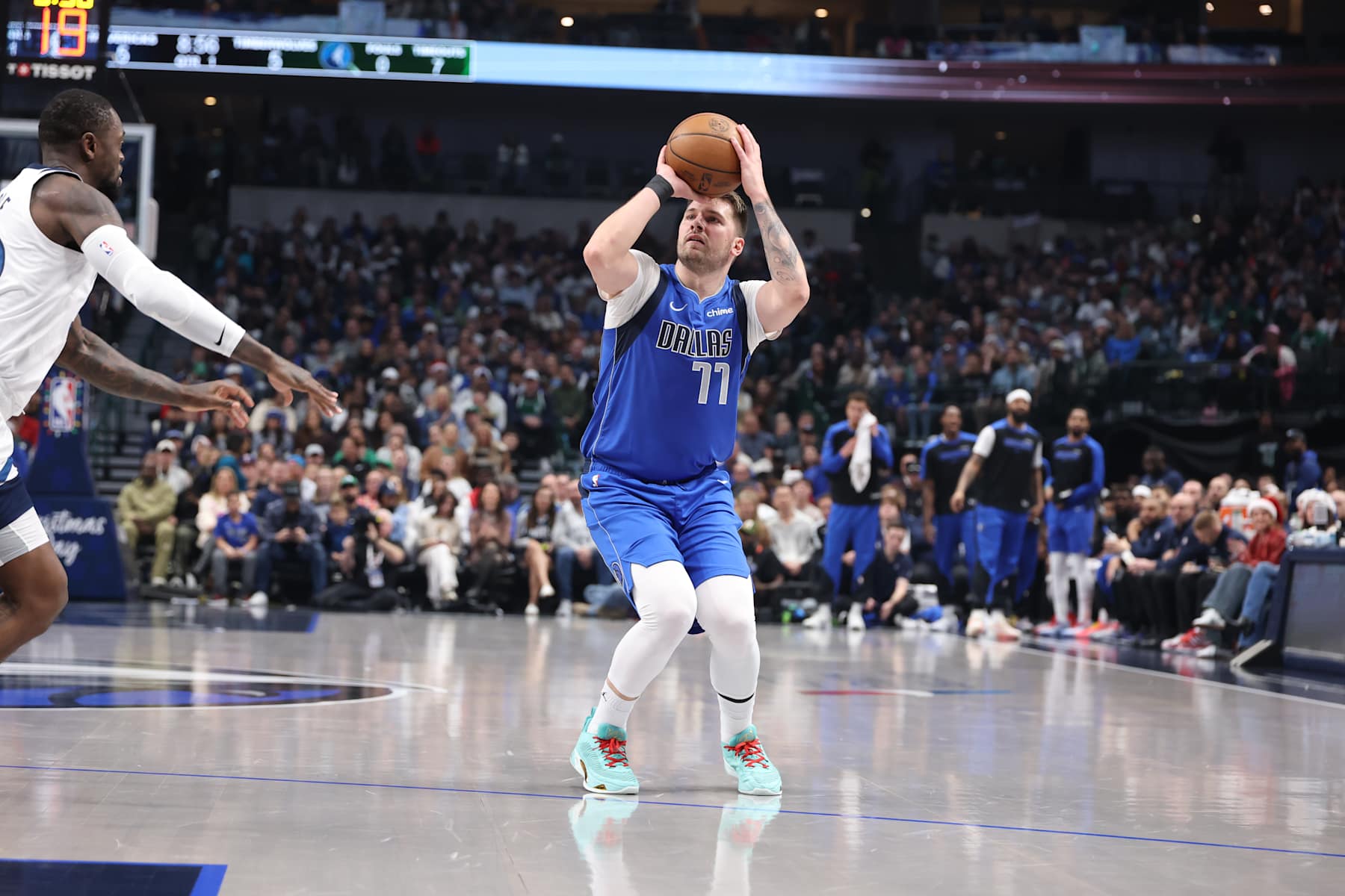 DALLAS, TX - DECEMBER 25:  Luka Doncic #77 of the Dallas Mavericks shoots the ball during the game against the Minnesota Timberwolveson December 25, 2024 at American Airlines Center in Dallas, Texas. NOTE TO USER: User expressly acknowledges and agrees that, by downloading and or using this photograph, User is consenting to the terms and conditions of the Getty Images License Agreement. Mandatory Copyright Notice: Copyright 2024 NBAE (Photo by David Sherman/NBAE via Getty Images)