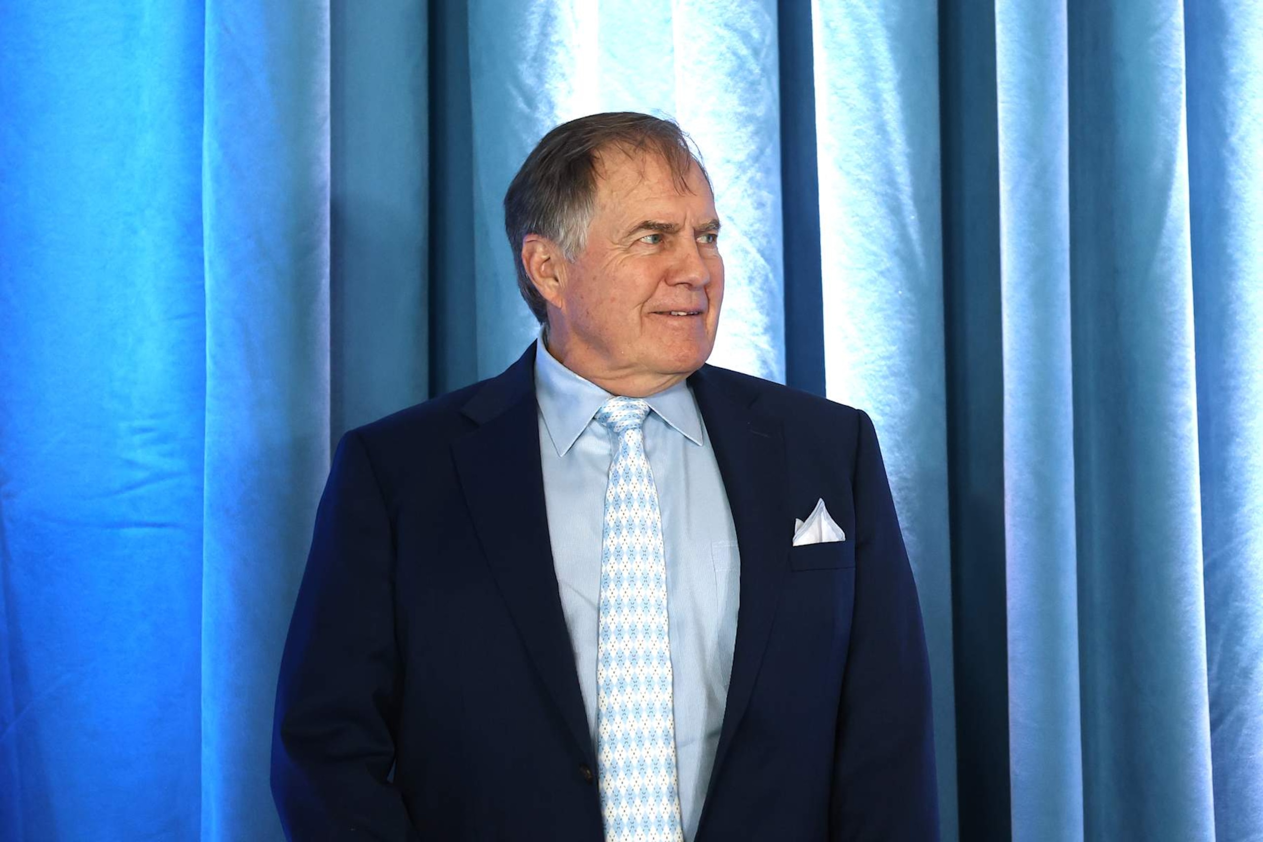 CHAPEL HILL, NORTH CAROLINA - DECEMBER 12: Head Coach Bill Belichick of the North Carolina Tar Heels smiles prior to a press conference on December 12, 2024 in Chapel Hill, North Carolina. (Photo by Jared C. Tilton/Getty Images)