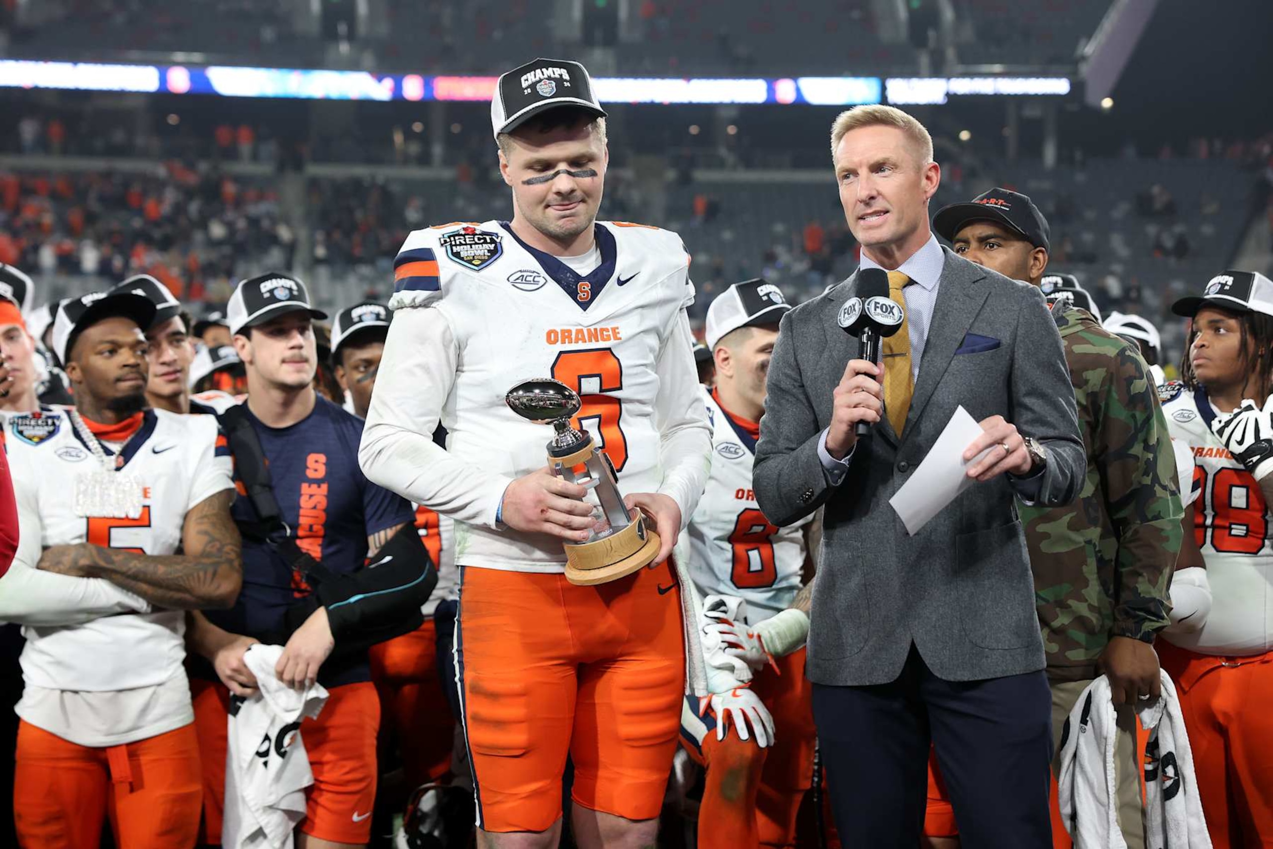 SAN DIEGO, CALIFORNIA - DECEMBER 27: Kyle McCord #6 of the Syracuse Orange is awarded the offensive player of the game after defeating Washington State Cougars 52-35 in the DirecTV Holiday Bowl at Snapdragon Stadium on December 27, 2024 in San Diego, California. (Photo by Sean M. Haffey/Getty Images) SAN DIEGO, CALIFORNIA - DECEMBER 27: Kyle McCord #6 of the Syracuse Orange is awarded the offensive player of the game after defeating Washington State Cougars 52-35 in the DirecTV Holiday Bowl at Snapdragon Stadium on December 27, 2024 in San Diego, California. (Photo by Sean M. Haffey/Getty Images)