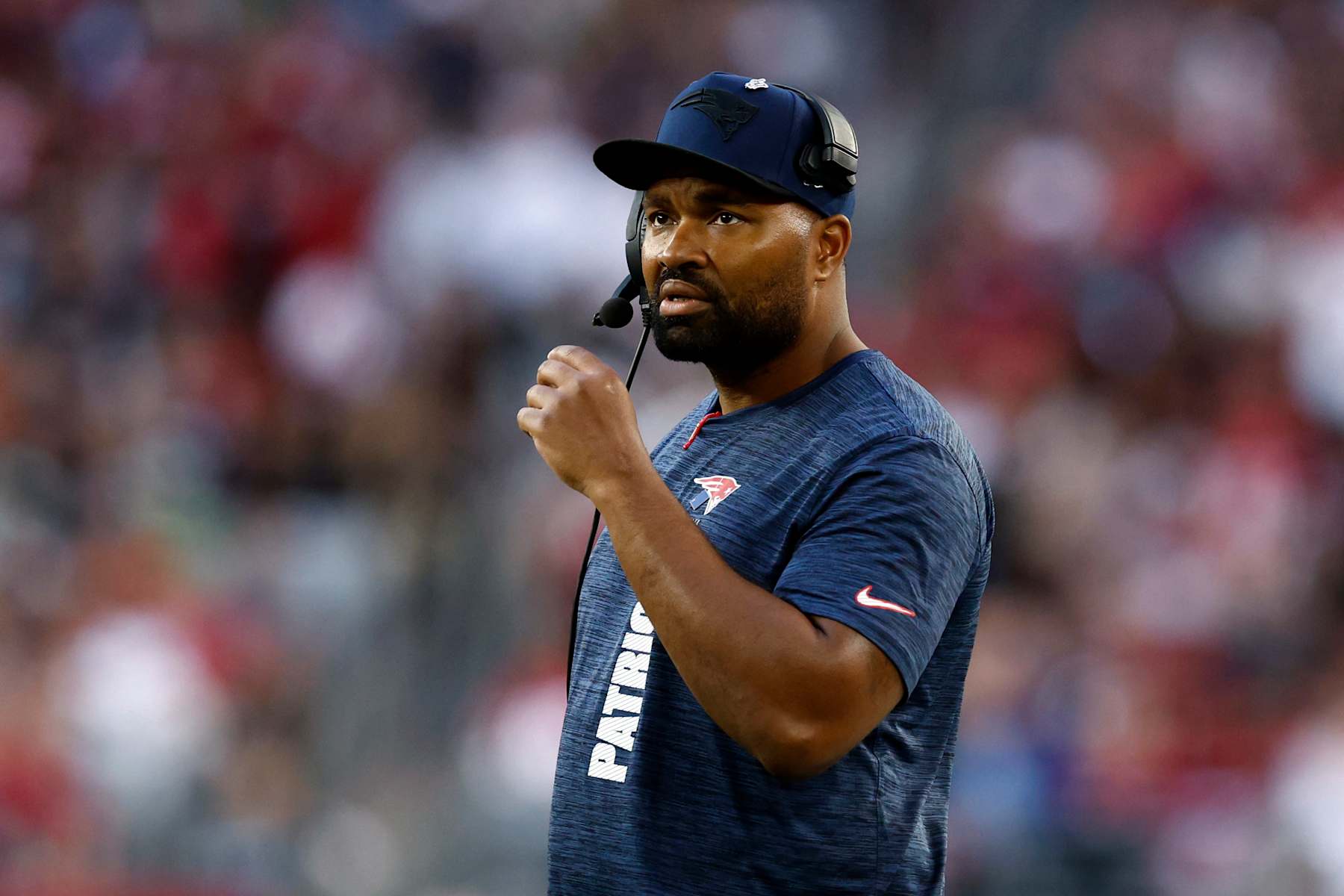 Glendale, AZ - December 15: New England Patriots head coach Jerod Mayo watches the replay of running back Antonio Gibson (not pictured) being stopped short of the end zone by the Arizona Cardinals defense in the third quarter at State Farm Stadium. (Photo by Danielle Parhizkaran/The Boston Globe via Getty Images)