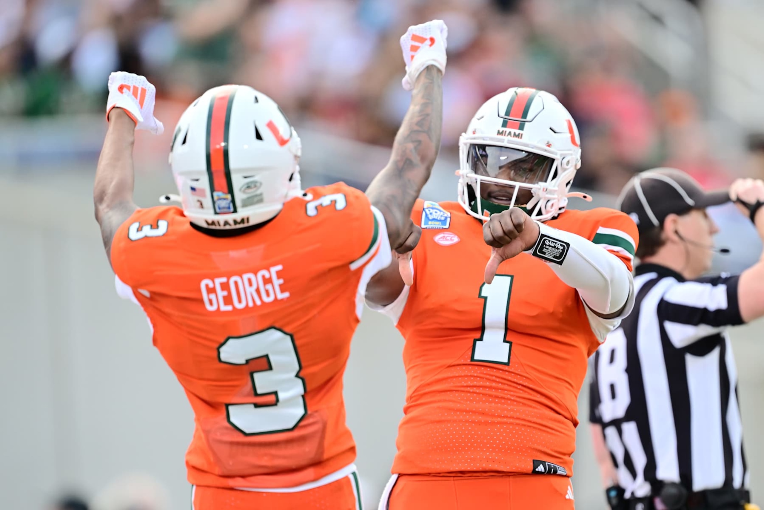 ORLANDO, FLORIDA - DECEMBER 28: Cam Ward #1 of the Miami Hurricanes celebrates with Jacolby George #3 after connecting for a touchdown in the first quarter during the 2024 Pop-Tarts Bowl at Camping World Stadium on December 28, 2024 in Orlando, Florida. (Photo by Julio Aguilar/Getty Images) ORLANDO, FLORIDA - DECEMBER 28: Cam Ward #1 of the Miami Hurricanes celebrates with Jacolby George #3 after connecting for a touchdown in the first quarter during the 2024 Pop-Tarts Bowl at Camping World Stadium on December 28, 2024 in Orlando, Florida. (Photo by Julio Aguilar/Getty Images)