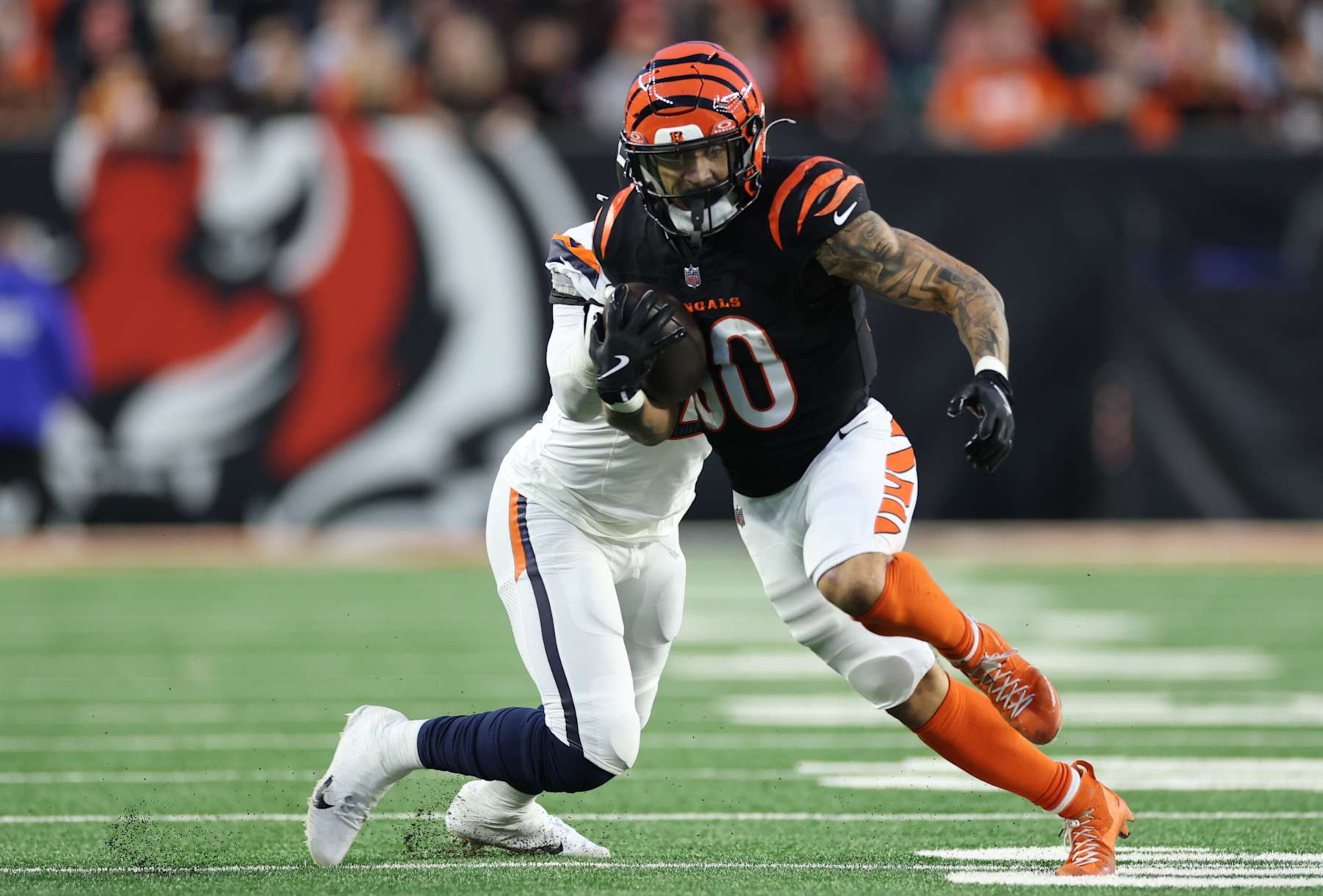CINCINNATI, OHIO - DECEMBER 28: Chase Brown #30 of the Cincinnati Bengals runs with the ball during the second quarter against the Denver Broncos at Paycor Stadium on December 28, 2024 in Cincinnati, Ohio. (Photo by Andy Lyons/Getty Images) CINCINNATI, OHIO - DECEMBER 28: Chase Brown #30 of the Cincinnati Bengals runs with the ball during the second quarter against the Denver Broncos at Paycor Stadium on December 28, 2024 in Cincinnati, Ohio. (Photo by Andy Lyons/Getty Images)