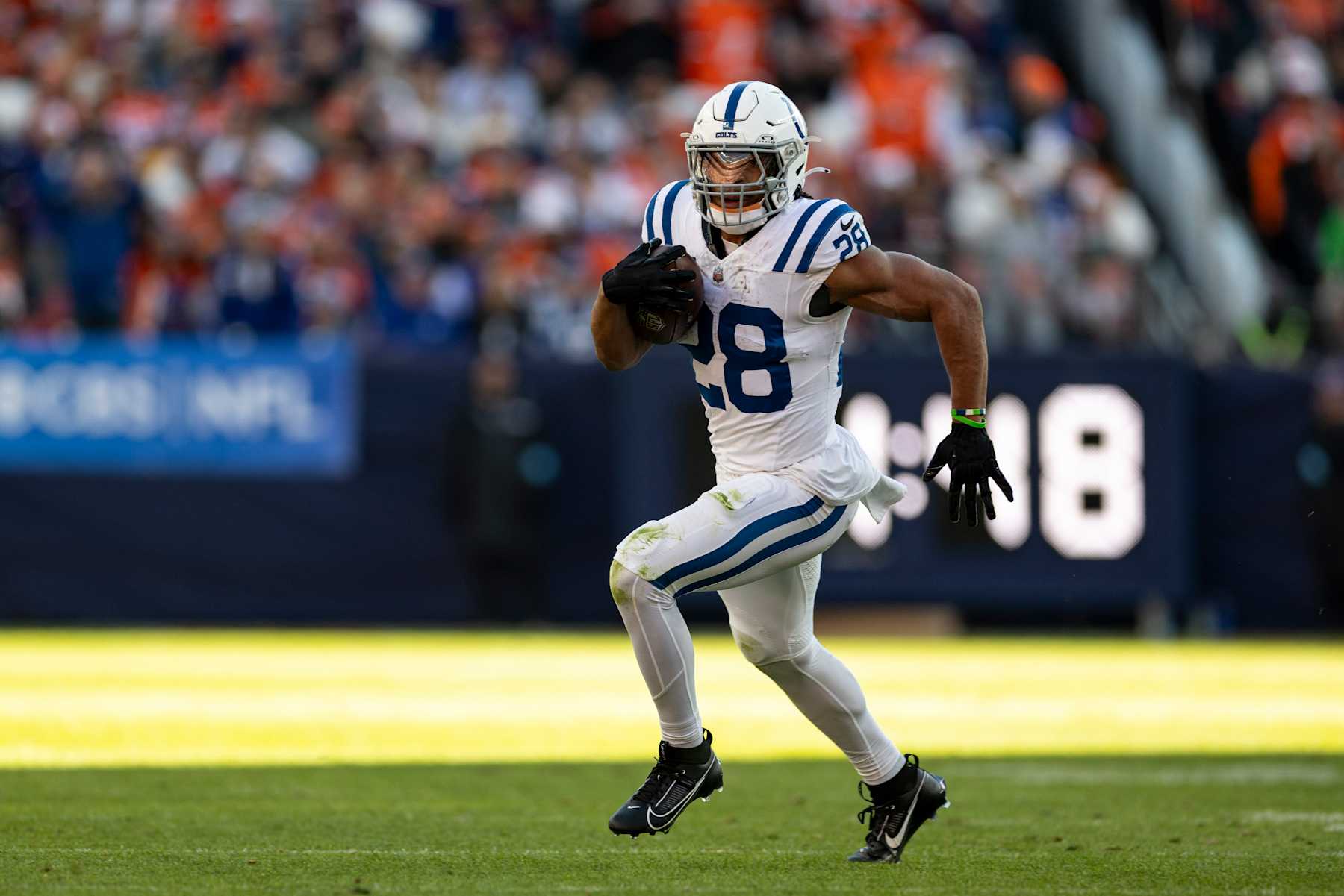 DENVER, COLORADO - DECEMBER 15: Jonathan Taylor #28 of the Indianapolis Colts runs with the ball during an NFL Football game against the Denver Broncos at Empower Field At Mile High on December 15, 2024 in Denver, Colorado. (Photo by Michael Owens/Getty Images)