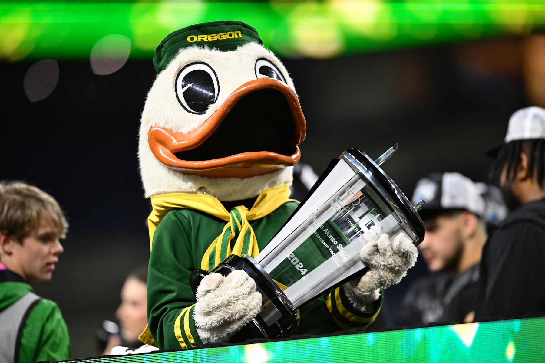 INDIANAPOLIS, IN - DECEMBER 07: The Oregon duck mascot holds the Stagg Championship Trophy following the Big Ten Championship football game between the Penn State Nittany Lions and the Oregon Ducks on December 7, 2024 at Lucas Oil Stadium in Indianapolis, IN (Photo by James Black/Icon Sportswire via Getty Images)