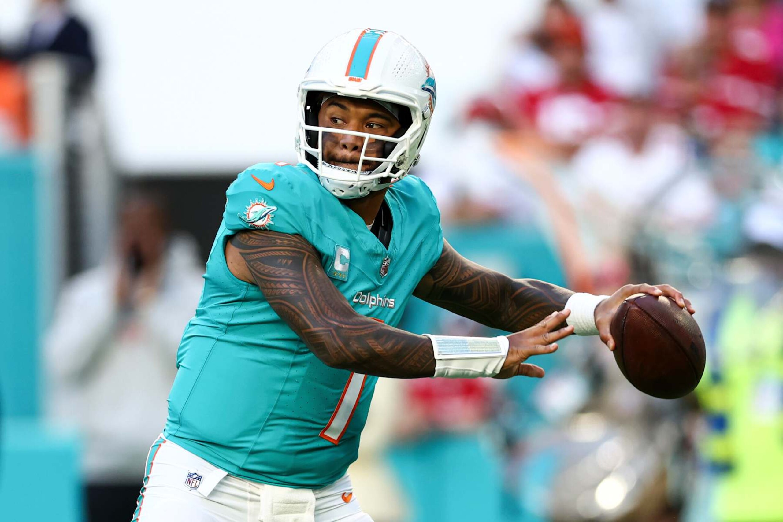 MIAMI GARDENS, FLORIDA - DECEMBER 22: Tua Tagovailoa #1 of the Miami Dolphins looks to throw a pass during the first half of an NFL football game against the San Francisco 49ers at Hard Rock Stadium on December 22, 2024 in Miami Gardens, Florida. (Photo by Kevin Sabitus/Getty Images) MIAMI GARDENS, FLORIDA - DECEMBER 22: Tua Tagovailoa #1 of the Miami Dolphins looks to throw a pass during the first half of an NFL football game against the San Francisco 49ers at Hard Rock Stadium on December 22, 2024 in Miami Gardens, Florida. (Photo by Kevin Sabitus/Getty Images)