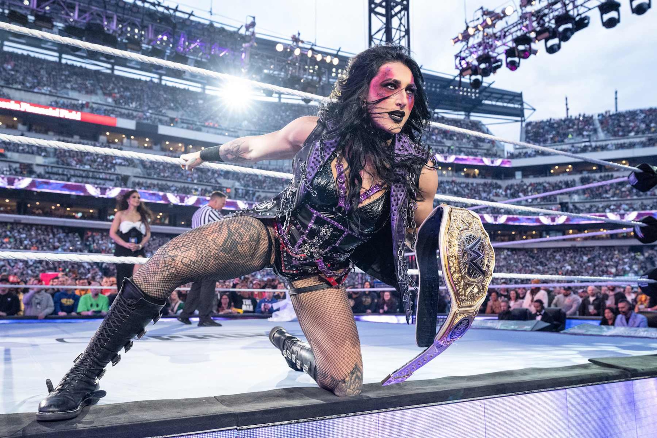 PHILADELPHIA, PENNSYLVANIA - APRIL 6: Rhea Ripley enters the ring during Night One of WrestleMania 40 at Lincoln Financial Field on April 6, 2024 in Philadelphia, Pennsylvania. (Photo by WWE/Getty Images) PHILADELPHIA, PENNSYLVANIA - APRIL 6: Rhea Ripley enters the ring during Night One of WrestleMania 40 at Lincoln Financial Field on April 6, 2024 in Philadelphia, Pennsylvania. (Photo by WWE/Getty Images)
