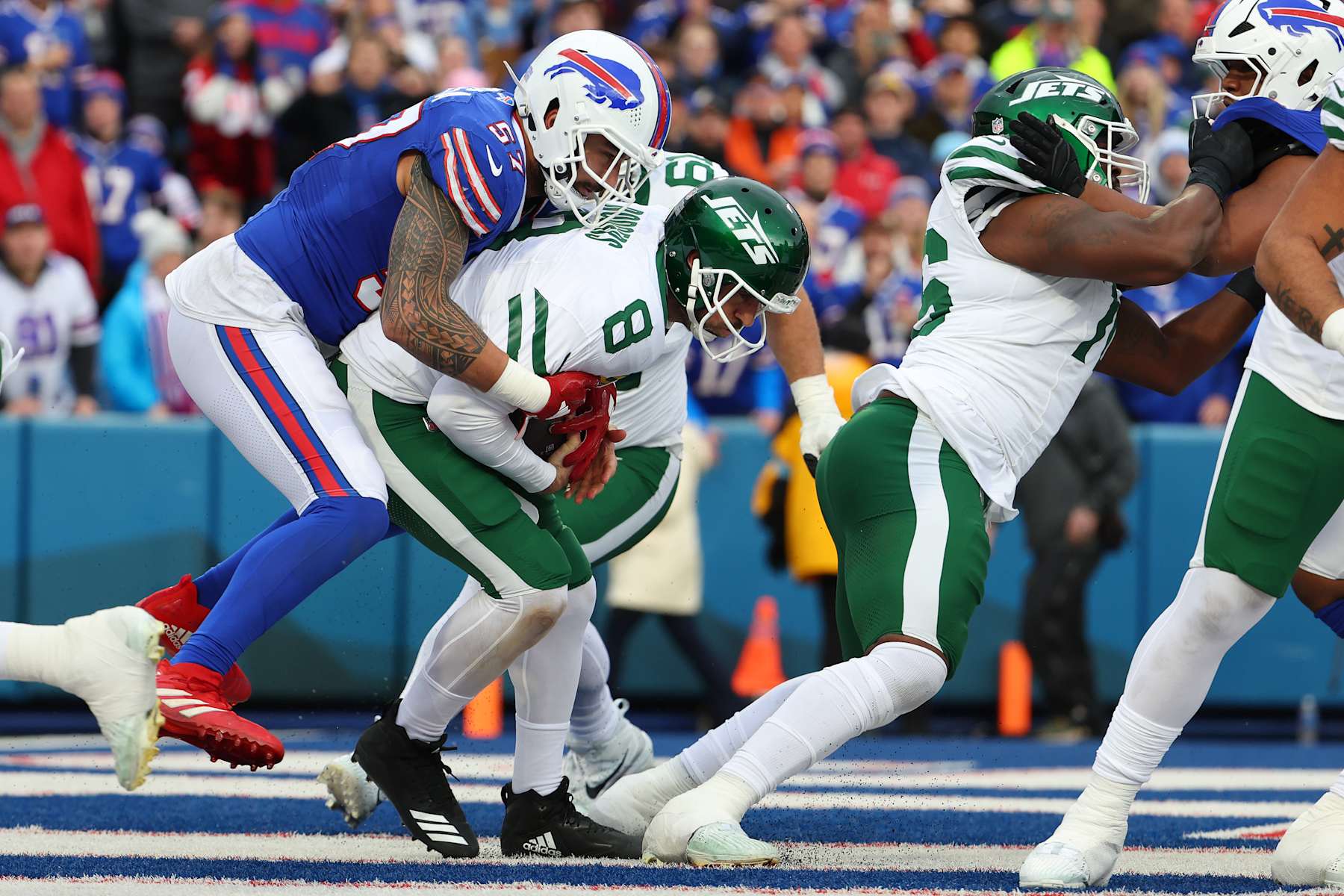 ORCHARD PARK, NEW YORK - DECEMBER 29: AJ Epenesa #57 of the Buffalo Bills sacks Aaron Rodgers #8 of the New York Jets for a safety during the second quarter at Highmark Stadium on December 29, 2024 in Orchard Park, New York. (Photo by Timothy T Ludwig/Getty Images)