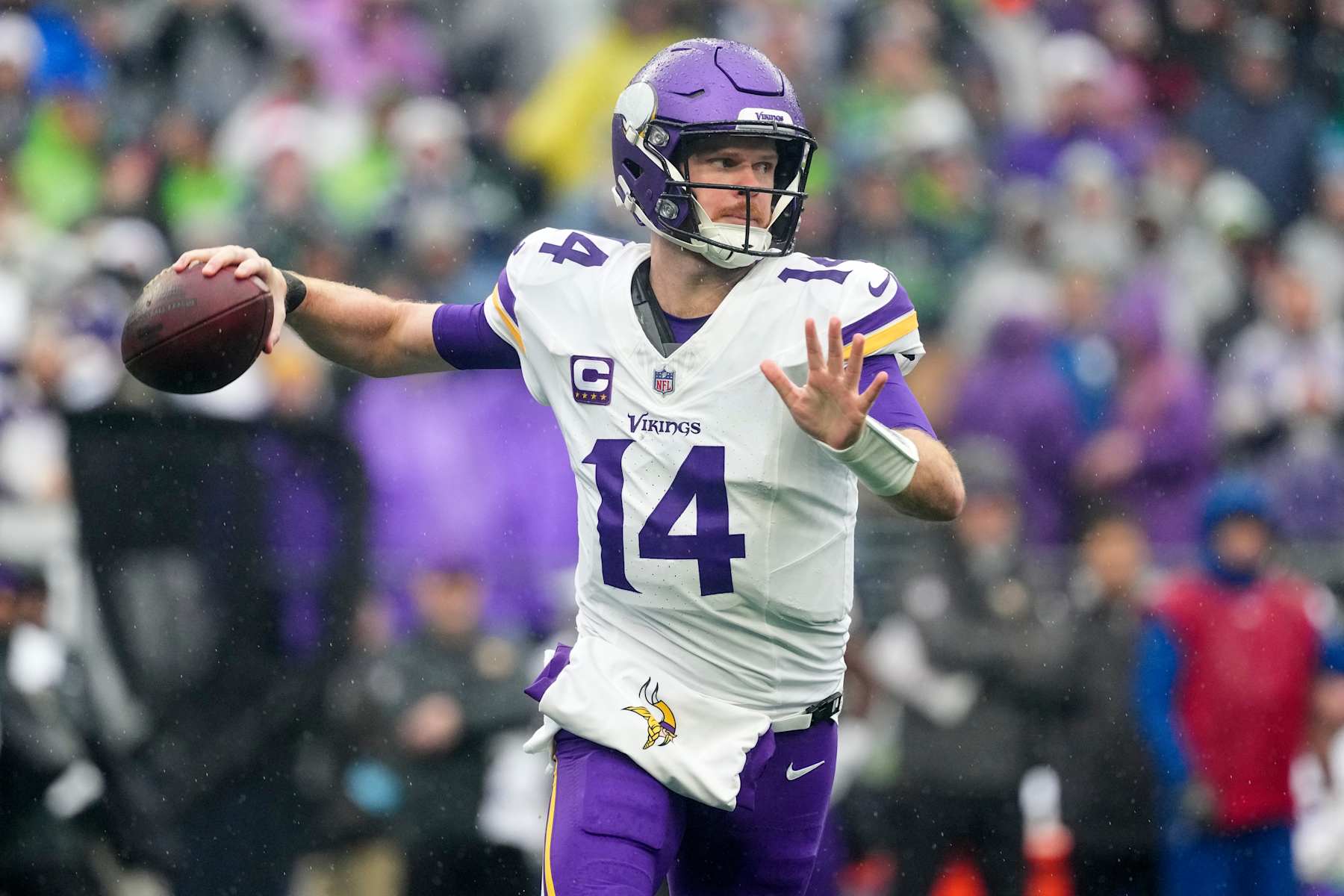 SEATTLE, WASHINGTON - DECEMBER 22: Sam Darnold #14 of the Minnesota Vikings looks to throw a pass in the first quarter of a game against the Seattle Seahawks at Lumen Field on December 22, 2024 in Seattle, Washington. (Photo by Christopher Mast/Getty Images)