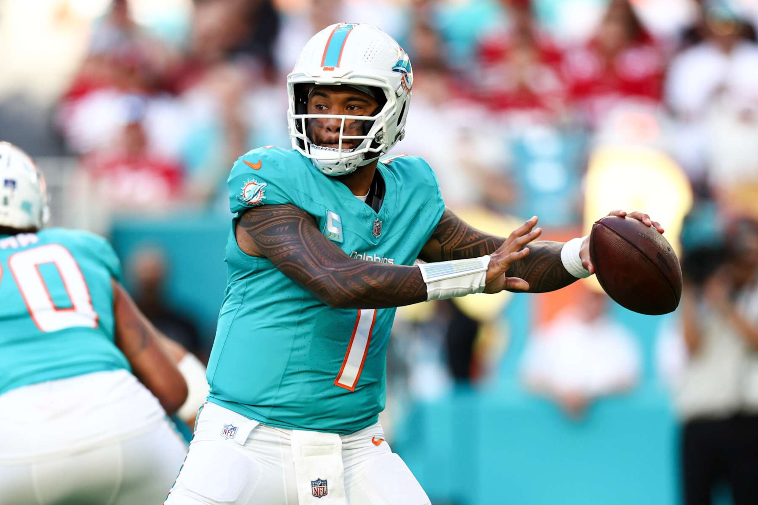 MIAMI GARDENS, FLORIDA - DECEMBER 22: Tua Tagovailoa #1 of the Miami Dolphins looks to throw a pass during the first half of an NFL football game against the San Francisco 49ers at Hard Rock Stadium on December 22, 2024 in Miami Gardens, Florida. (Photo by Kevin Sabitus/Getty Images) MIAMI GARDENS, FLORIDA - DECEMBER 22: Tua Tagovailoa #1 of the Miami Dolphins looks to throw a pass during the first half of an NFL football game against the San Francisco 49ers at Hard Rock Stadium on December 22, 2024 in Miami Gardens, Florida. (Photo by Kevin Sabitus/Getty Images)