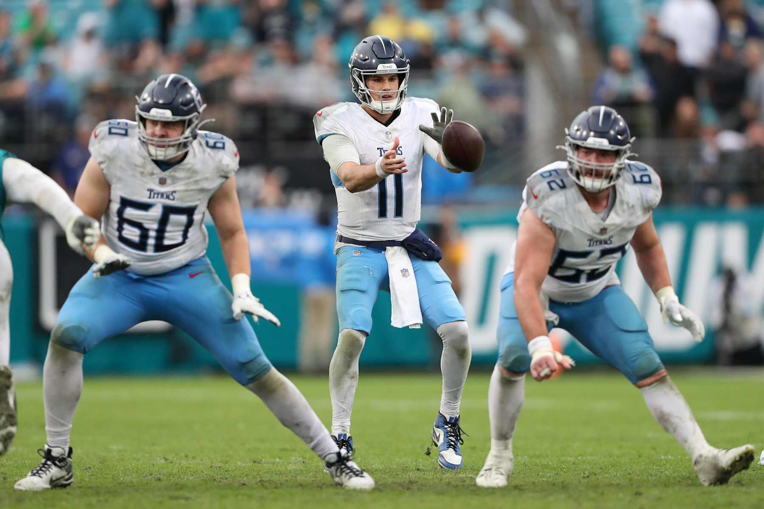 JACKSONVILLE, FLORIDA - DECEMBER 29: Mason Rudolph #11 of the Tennessee Titans receives the snap against the Jacksonville Jaguars during the fourth quarter at EverBank Stadium on December 29, 2024 in Jacksonville, Florida. (Photo by Courtney Culbreath/Getty Images)