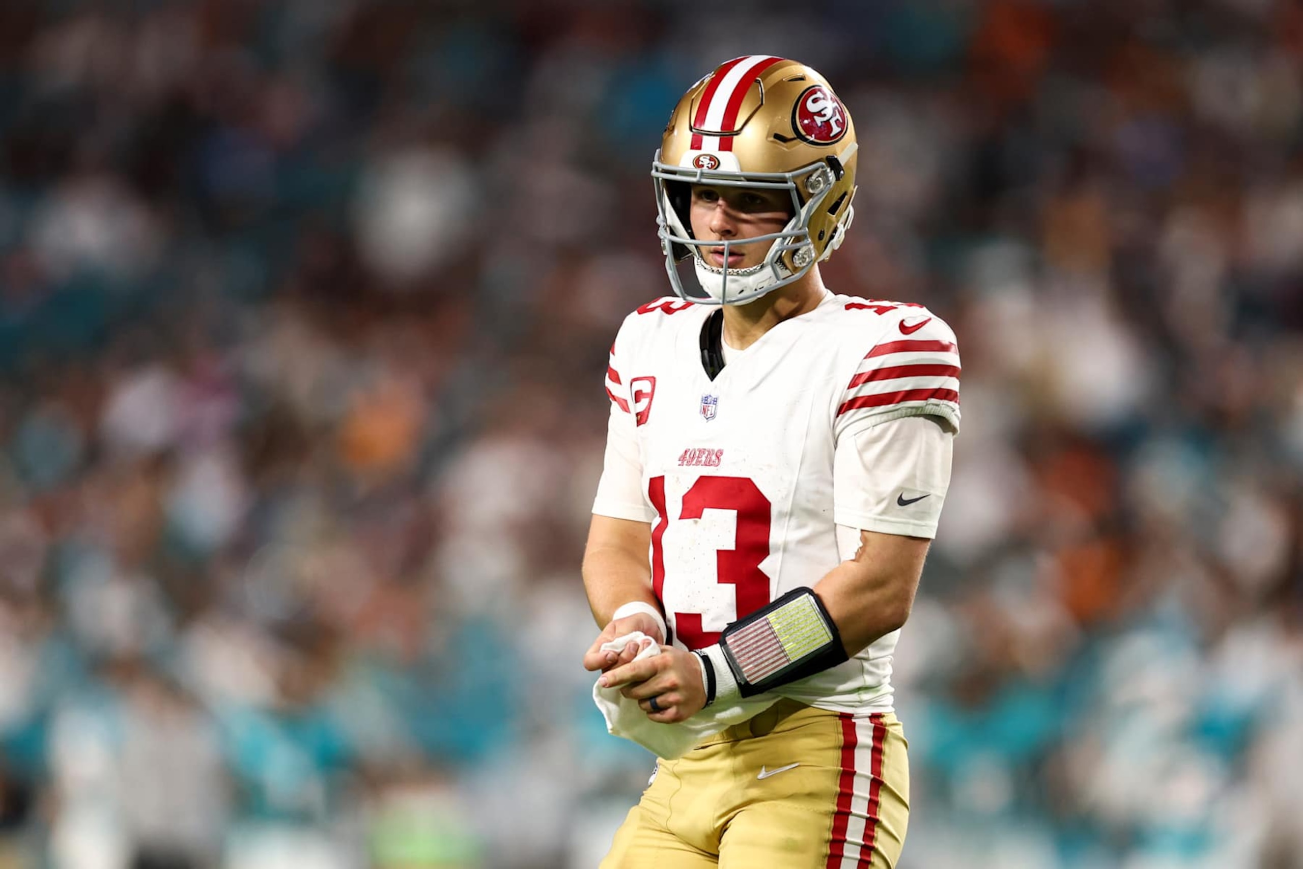 MIAMI GARDENS, FLORIDA - DECEMBER 22: Brock Purdy #13 of the San Francisco 49ers reacts during the second half of an NFL football game against the Miami Dolphins at Hard Rock Stadium on December 22, 2024 in Miami Gardens, Florida. (Photo by Kevin Sabitus/Getty Images) MIAMI GARDENS, FLORIDA - DECEMBER 22: Brock Purdy #13 of the San Francisco 49ers reacts during the second half of an NFL football game against the Miami Dolphins at Hard Rock Stadium on December 22, 2024 in Miami Gardens, Florida. (Photo by Kevin Sabitus/Getty Images)