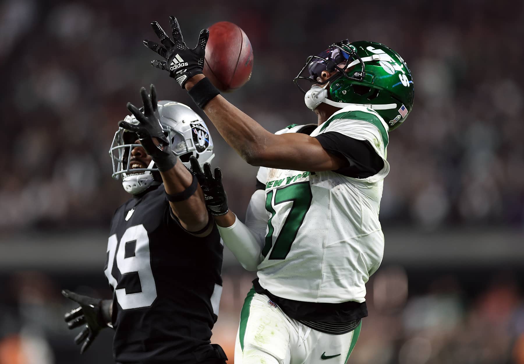 LAS VEGAS, NEVADA - NOVEMBER 12:  Wide receiver Garrett Wilson #17 of the New York Jets cannot hold on to the ball as cornerback Nate Hobbs #39 of the Las Vegas Raiders breaks up the pass during the 4th quarter of the game at Allegiant Stadium on November 12, 2023 in Las Vegas, Nevada. (Photo by Sean M. Haffey/Getty Images)