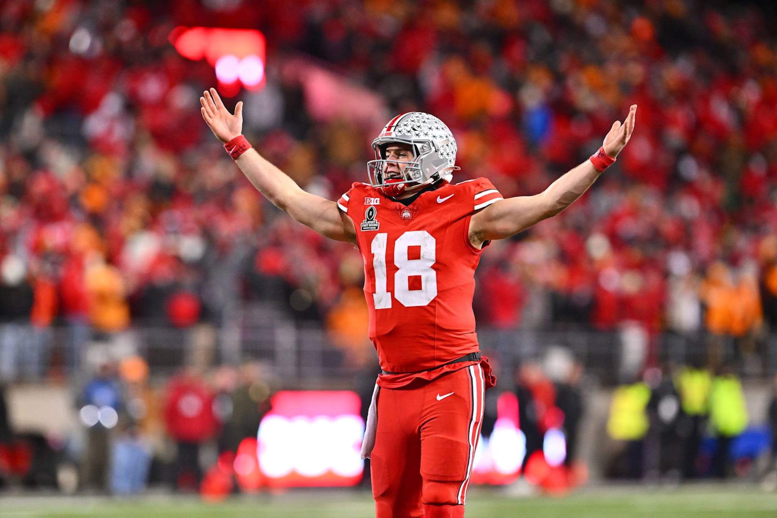 COLUMBUS, OHIO - DECEMBER 21: Will Howard #18 of the Ohio State Buckeyes celebrates after a Buckeyes touchdown against the Tennessee Volunteers during the fourth quarter in the Playoff First Round Game at Ohio Stadium on December 21, 2024 in Columbus, Ohio.  (Photo by Jason Miller/Getty Images)