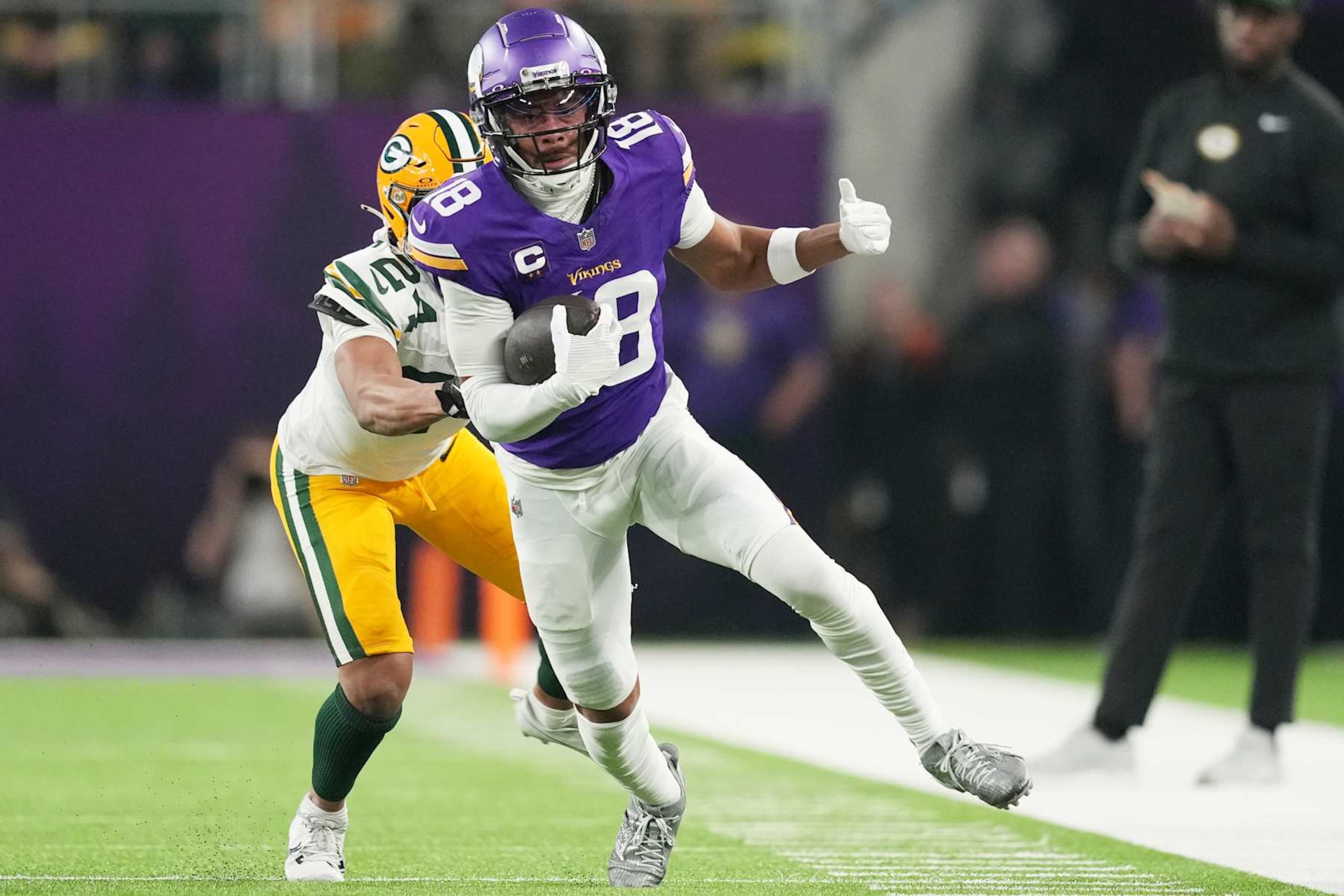 MINNEAPOLIS, MINNESOTA - DECEMBER 29: Justin Jefferson #18 of the Minnesota Vikings runs with the ball during the second quarter against the Green Bay Packers at U.S. Bank Stadium on December 29, 2024 in Minneapolis, Minnesota. (Photo by Brace Hemmelgarn/Getty Images)