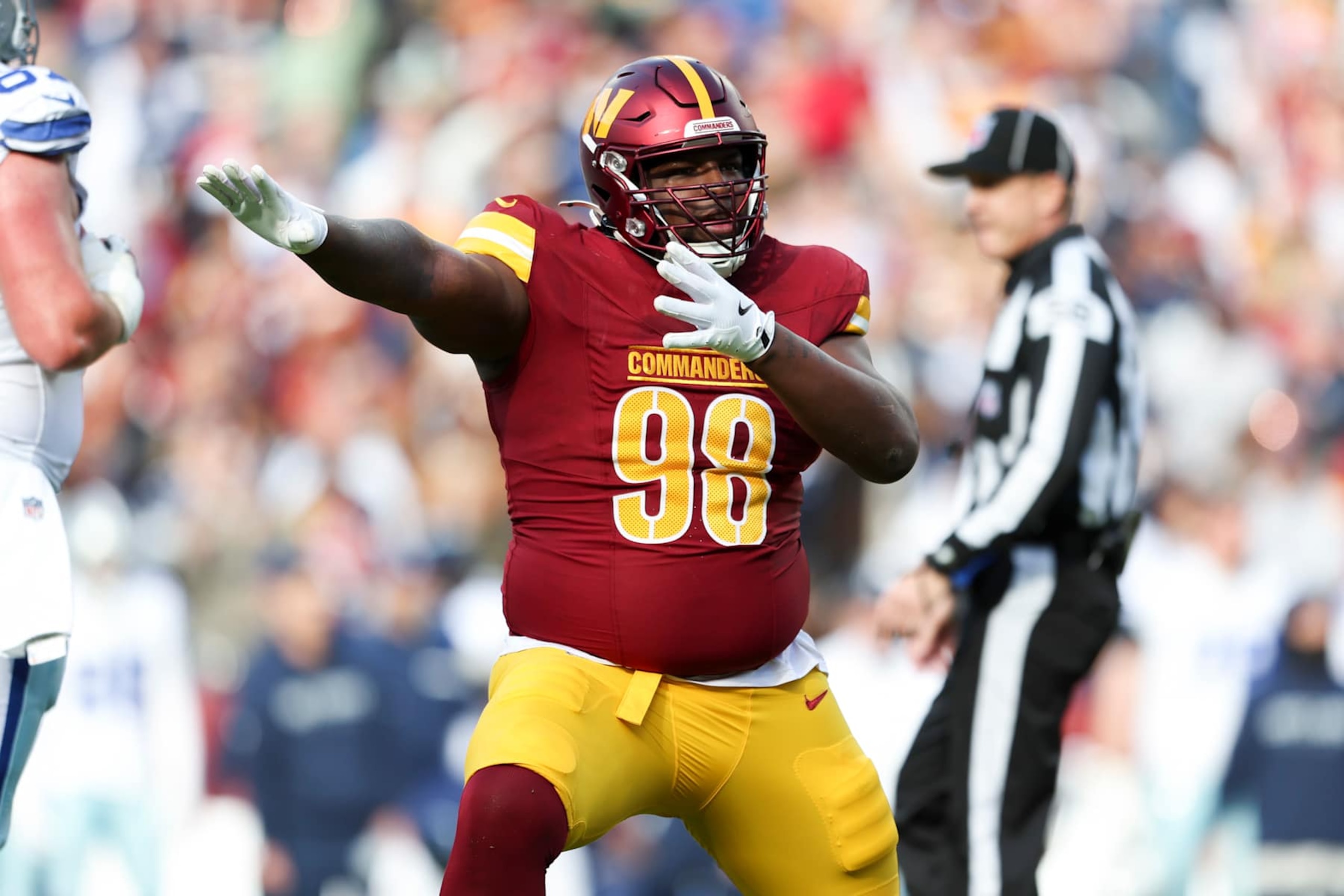 LANDOVER, MARYLAND - NOVEMBER 24: Phidarian Mathis #98 of the Washington Commanders celebrates after a play during a game against the Dallas Cowboys at Northwest Stadium on November 24, 2024 in Landover, Maryland. The Cowboys defeated the Commanders 34-26. (Kara Durrette/Getty Images) LANDOVER, MARYLAND - NOVEMBER 24: Phidarian Mathis #98 of the Washington Commanders celebrates after a play during a game against the Dallas Cowboys at Northwest Stadium on November 24, 2024 in Landover, Maryland. The Cowboys defeated the Commanders 34-26. (Kara Durrette/Getty Images)