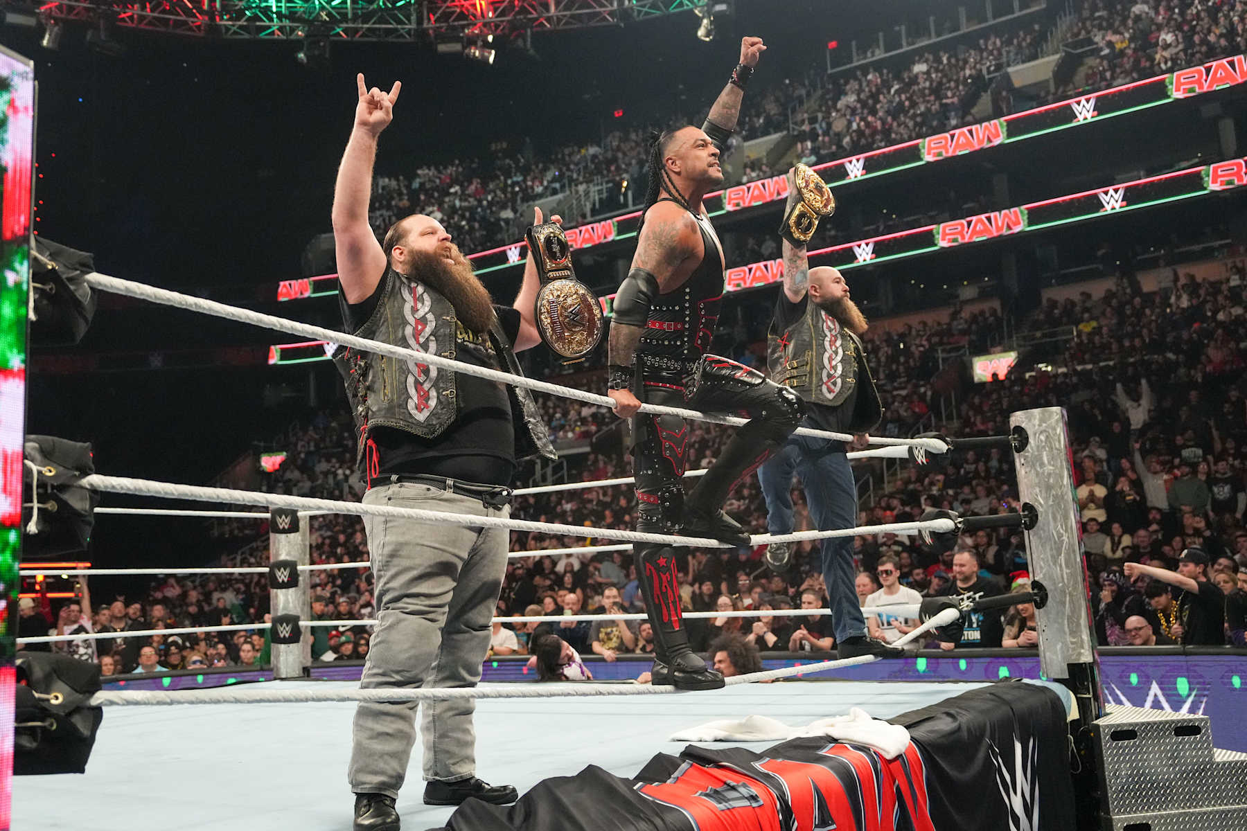 BOSTON, MASSACHUSETTS - DECEMBER 23: Damian Priest and the War Raiders, Ivar & Erik, stand victorious after their win during Monday Night RAW at TD Garden on December 23, 2024 in Boston, Massachusetts.  (Photo by WWE/Getty Images)