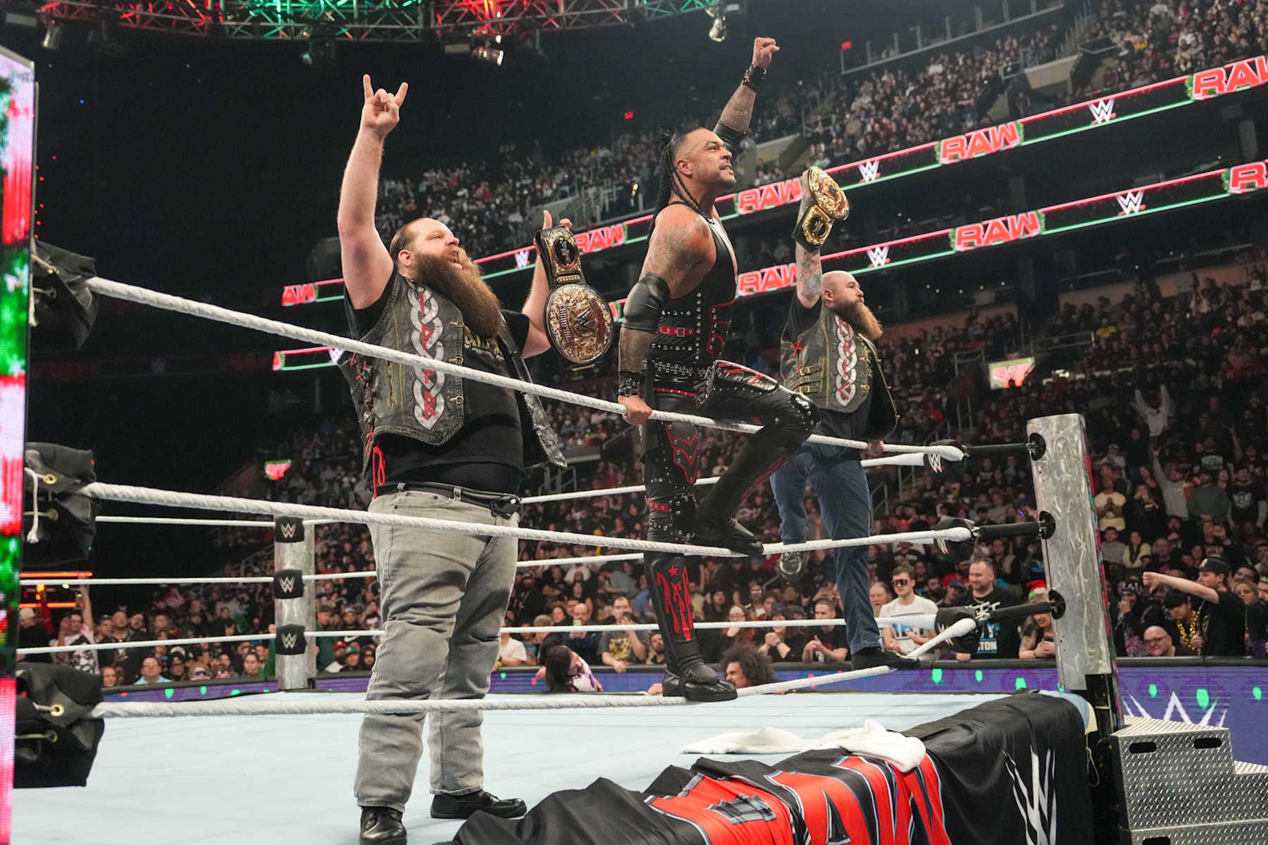 BOSTON, MASSACHUSETTS - DECEMBER 23: Damian Priest and the War Raiders, Ivar & Erik, stand victorious after their win during Monday Night RAW at TD Garden on December 23, 2024 in Boston, Massachusetts.  (Photo by WWE/Getty Images)