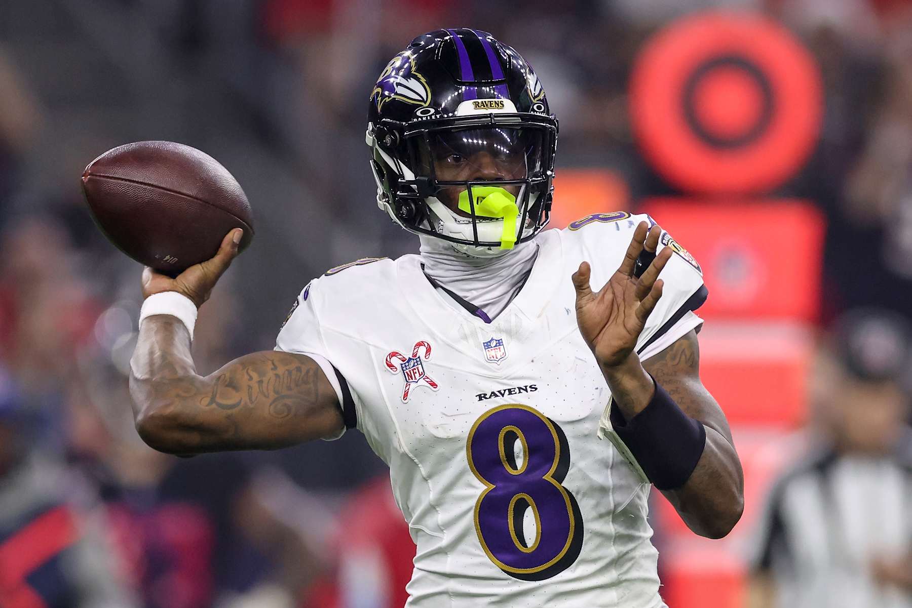 HOUSTON, TEXAS - DECEMBER 25: Lamar Jackson #8 of the Baltimore Ravens throws a pass in the second half against the Houston Texans at NRG Stadium on December 25, 2024 in Houston, Texas. (Photo by Tim Warner/Getty Images)