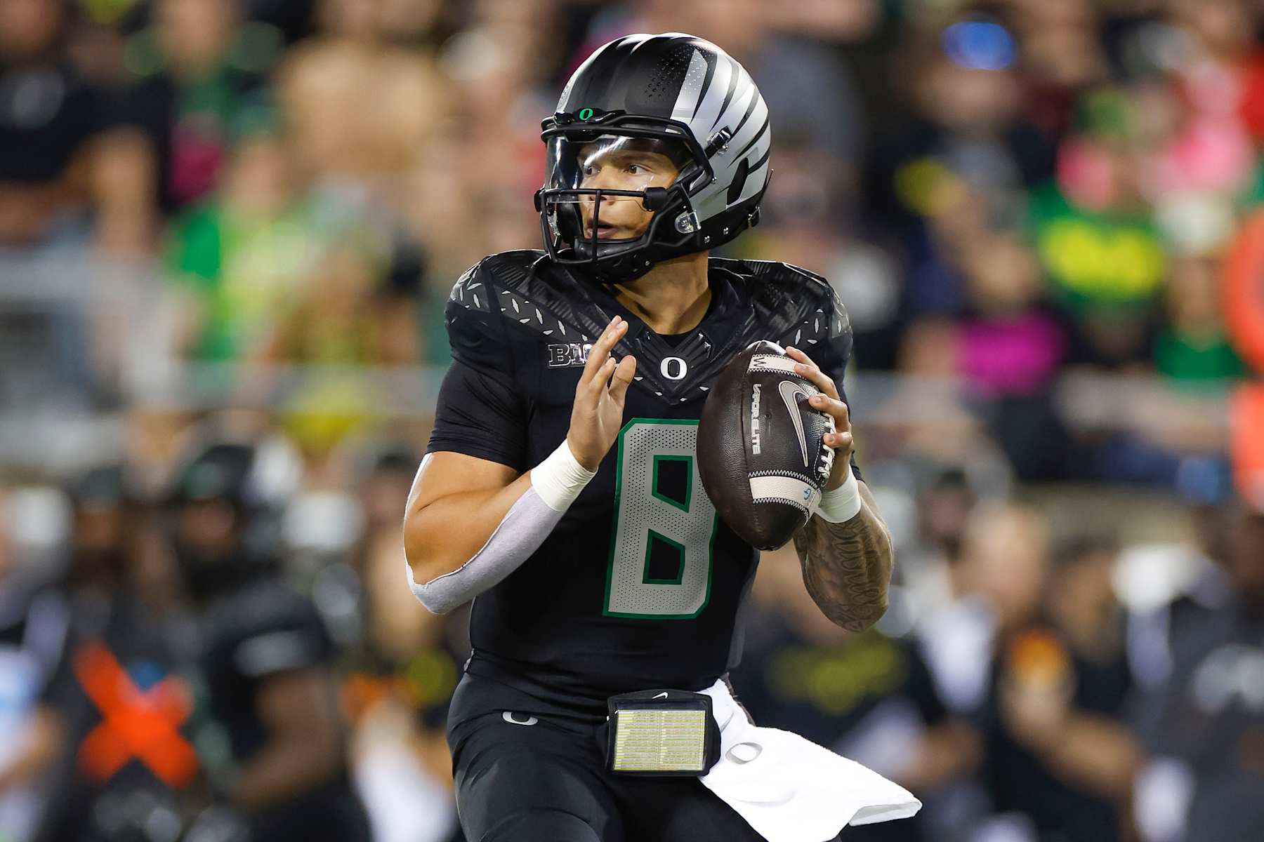 EUGENE, OREGON - OCTOBER 12: Dillon Gabriel #8 of the Oregon Ducks throws a pass during the second half against the Ohio State Buckeyes at Autzen Stadium on October 12, 2024 in Eugene, Oregon. (Photo by Brandon Sloter/Image Of Sport/Getty Images)