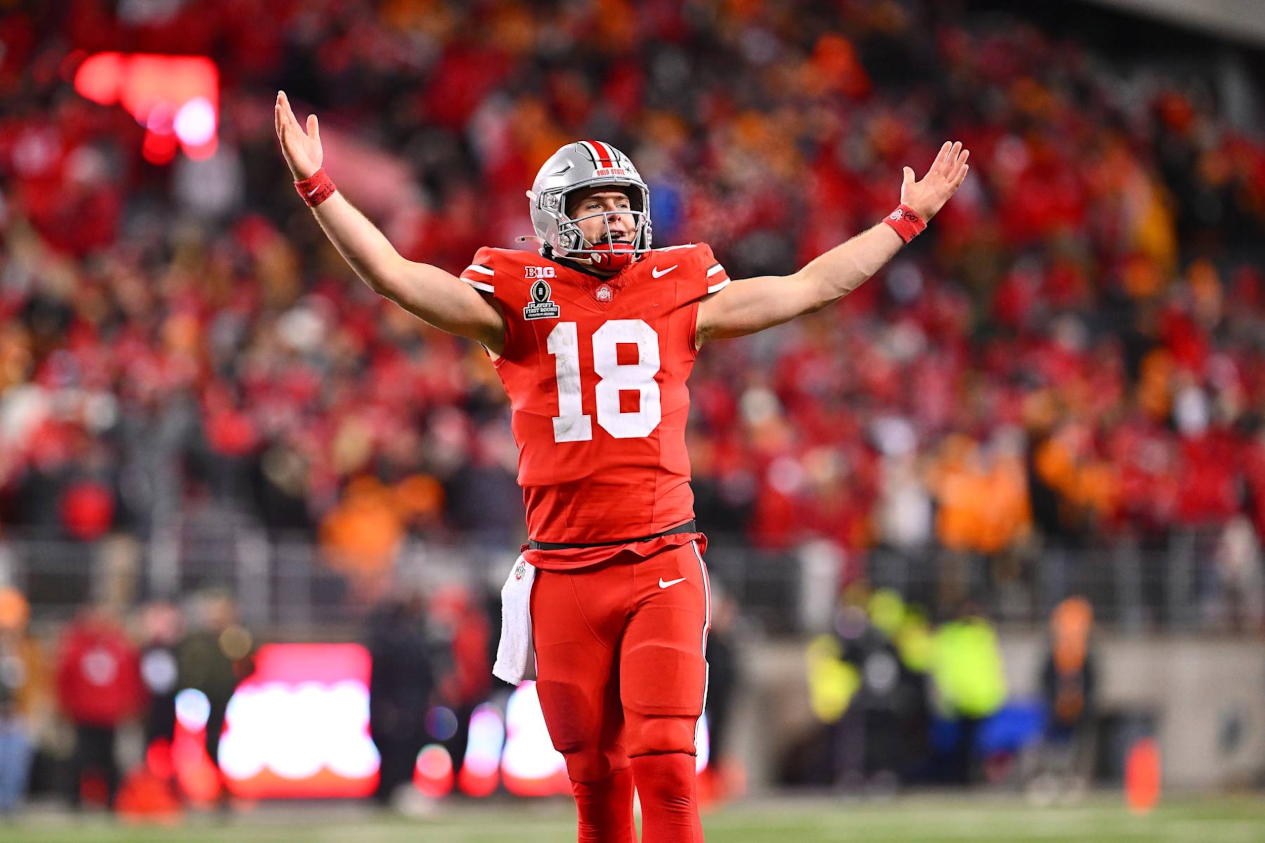 COLUMBUS, OHIO - DECEMBER 21: Will Howard #18 of the Ohio State Buckeyes celebrates after a Buckeyes touchdown against the Tennessee Volunteers during the fourth quarter in the Playoff First Round Game at Ohio Stadium on December 21, 2024 in Columbus, Ohio.  (Photo by Jason Miller/Getty Images)