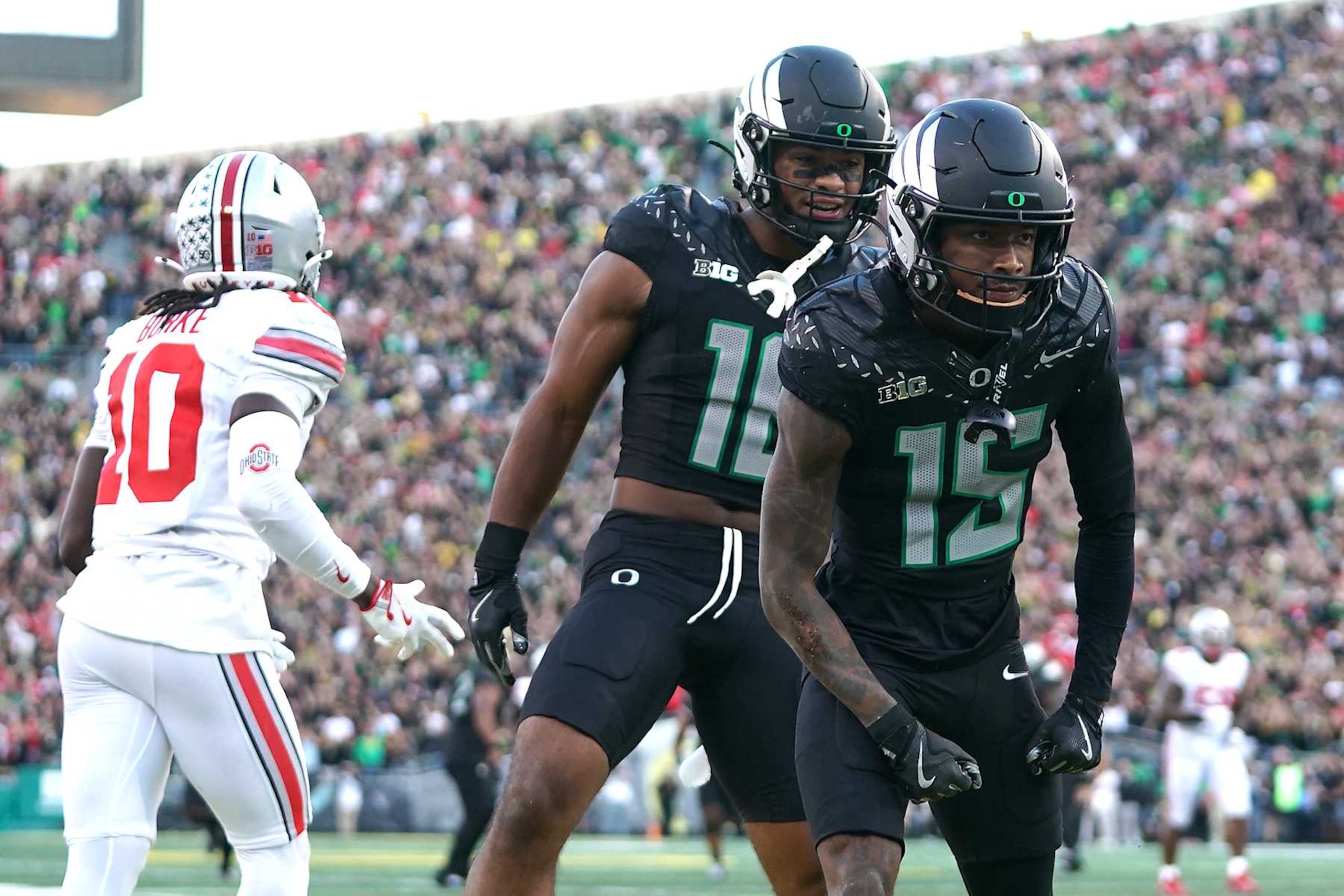 EUGENE, OREGON - OCTOBER 12: Tez Johnson #15 of the Oregon Ducks celebrates after catching a pass against Denzel Burke #10 of the Ohio State Buckeyes for a touchdown during the second quarter at Autzen Stadium on October 12, 2024 in Eugene, Oregon. (Photo by Ali Gradischer/Getty Images)